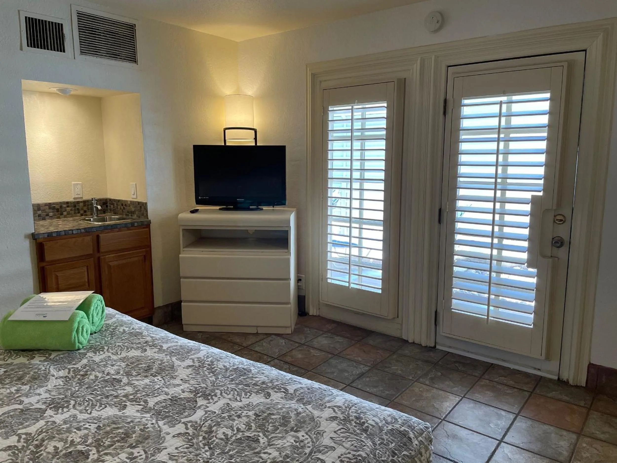 Bed in Desert Paradise - A Men's Clothing Optional Resort