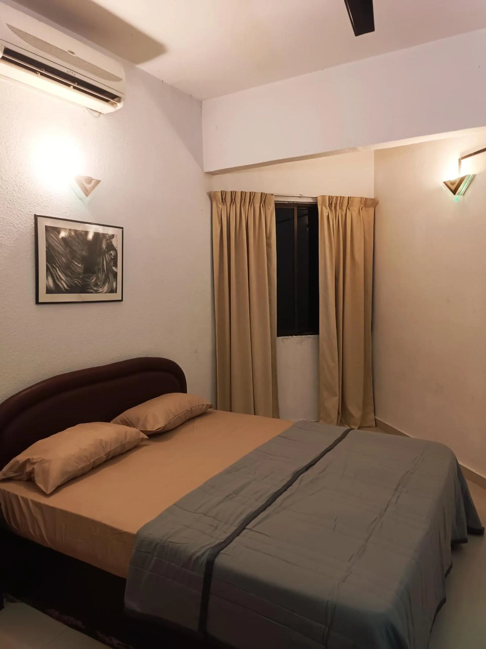 Bed in Sri Sayang Resort Apartment