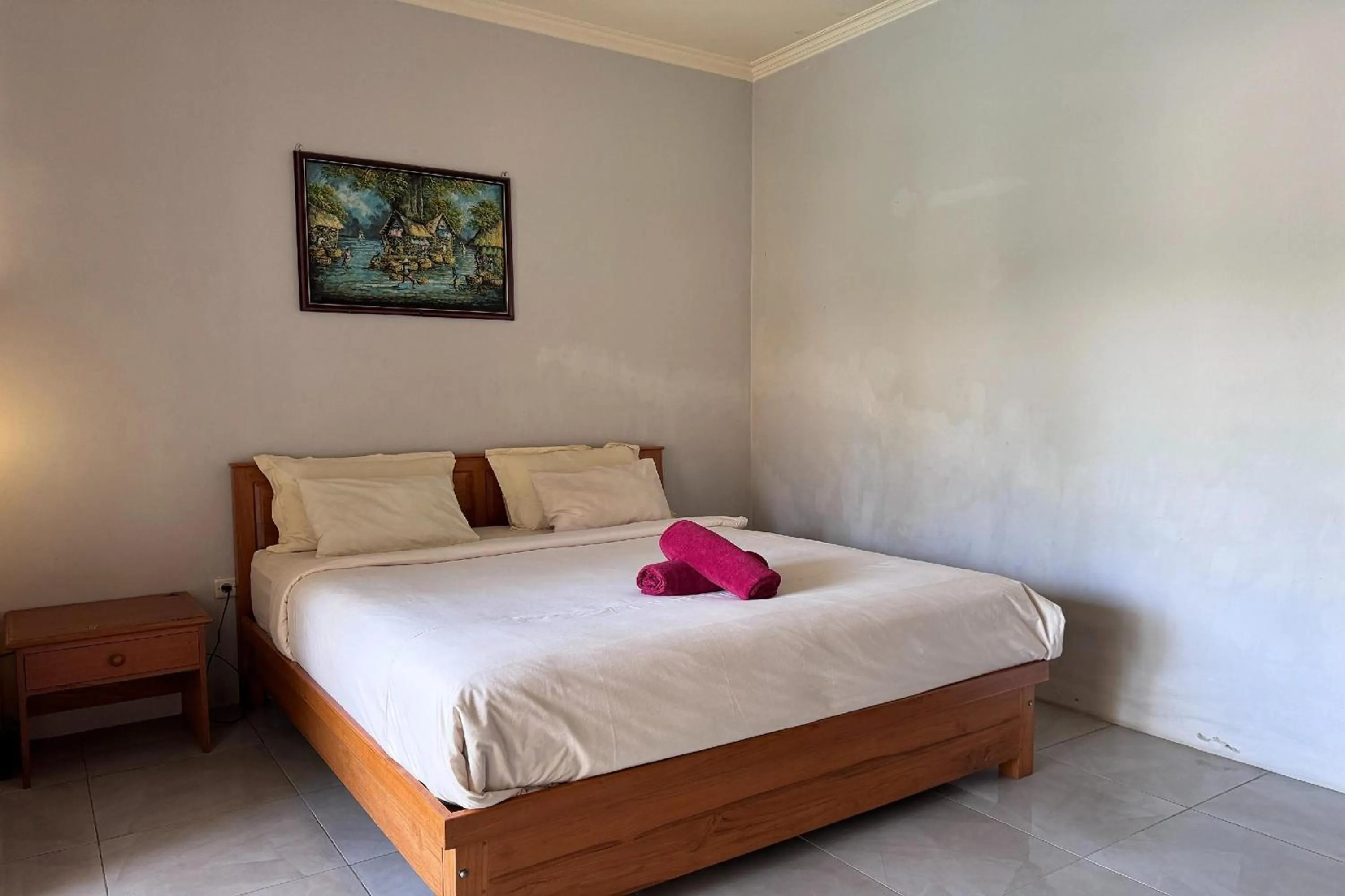 Bed in Senggigi Cottages Lombok