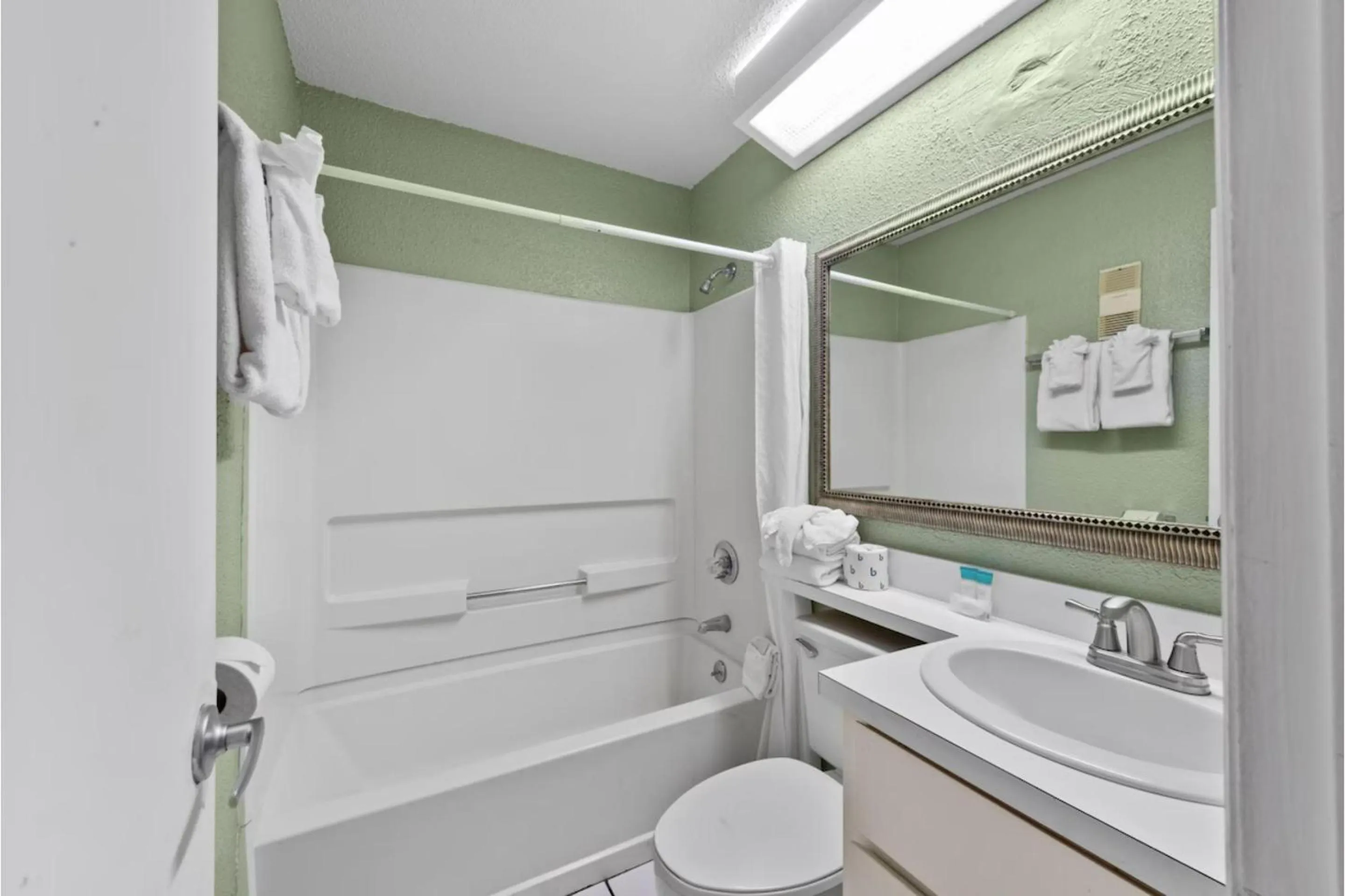 Bathroom in Capital O Sunset Waves Hotel Myrtle Beach Oceanfront