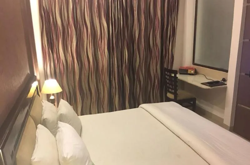 Bed in Shiva Oasis Resort