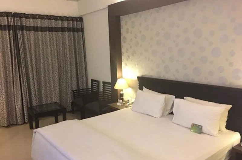 Bed in Shiva Oasis Resort