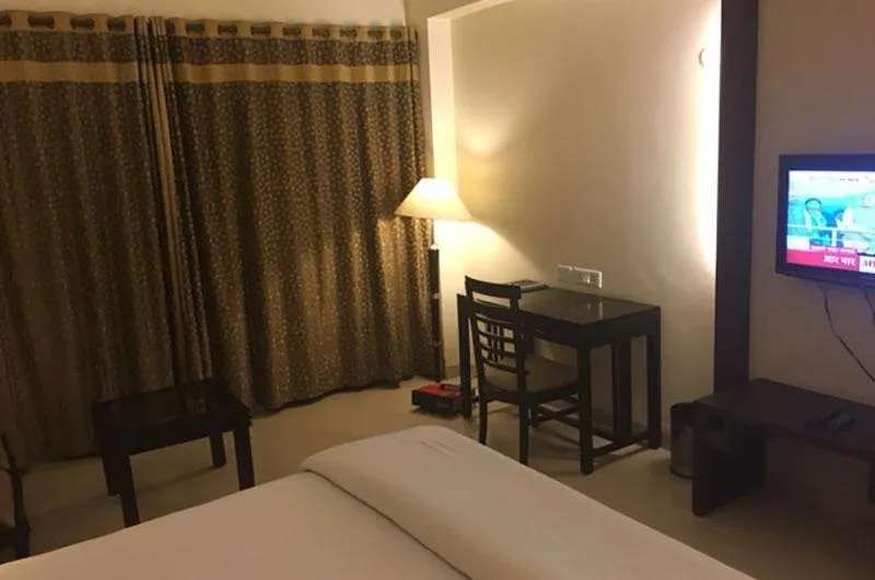 Bed in Shiva Oasis Resort