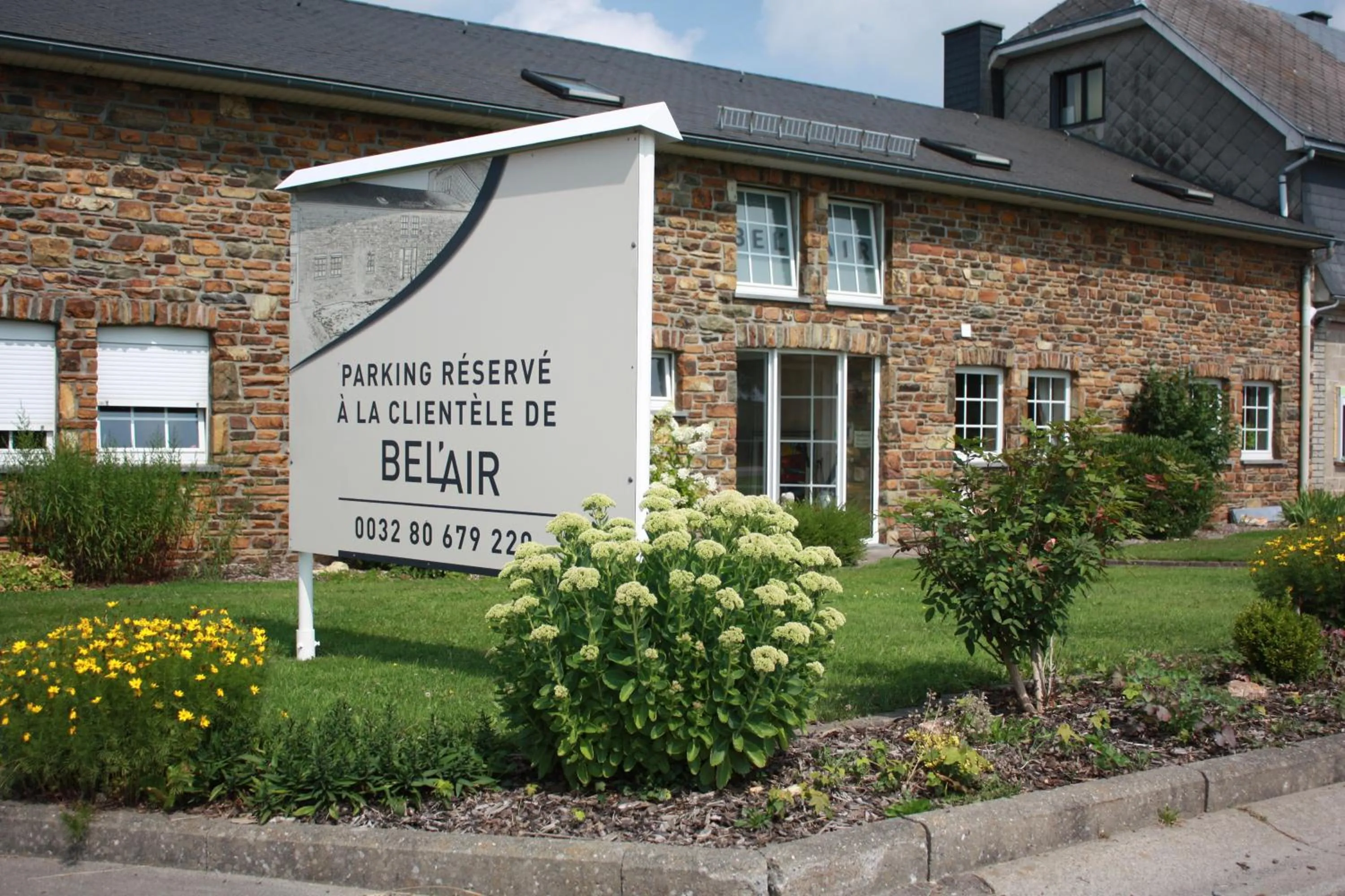 Property logo or sign in Hôtel Belair "Ravel Etape"