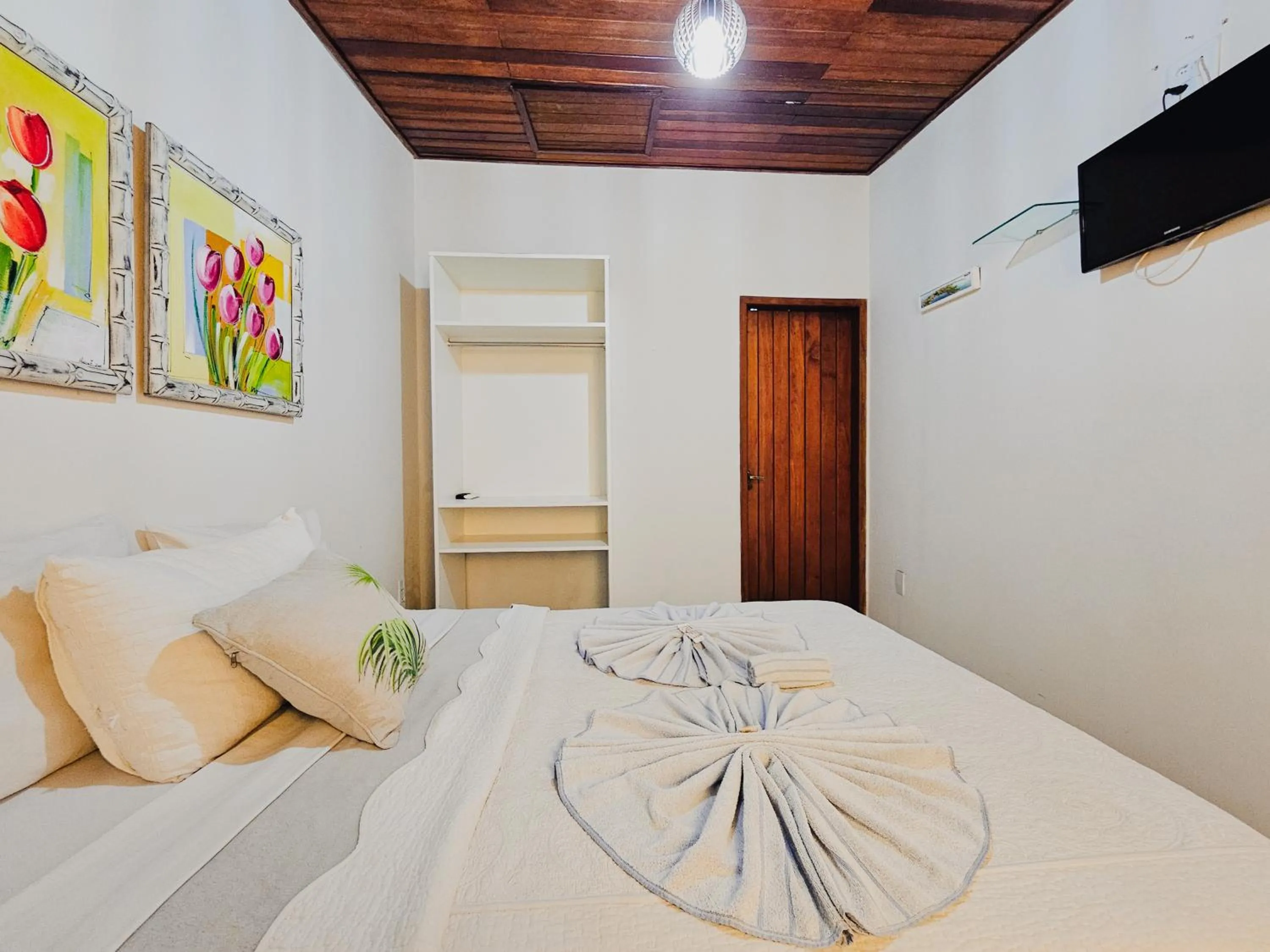 Bed in Pousada Praia e Conforto