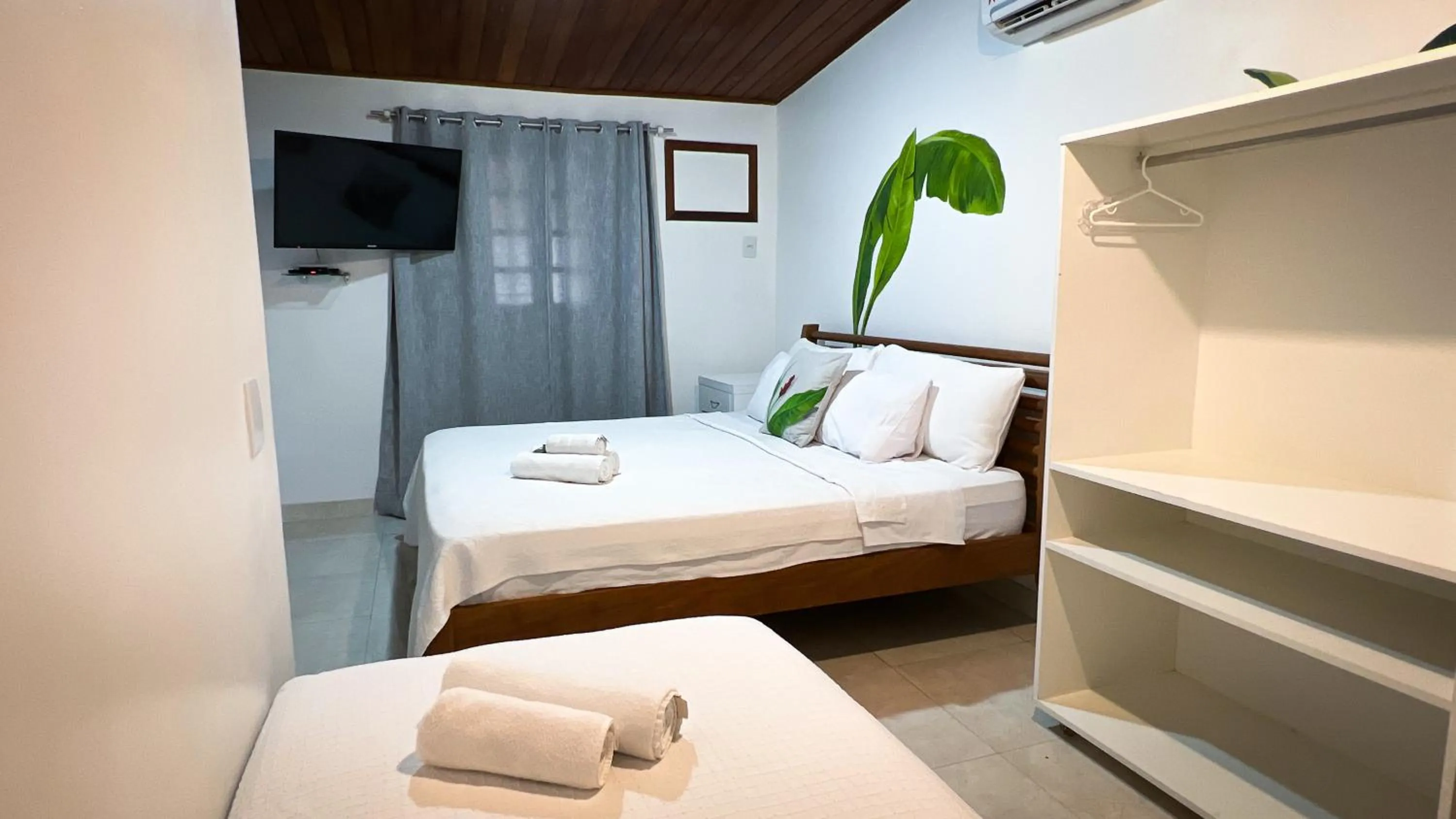 Bed in Pousada Praia e Conforto