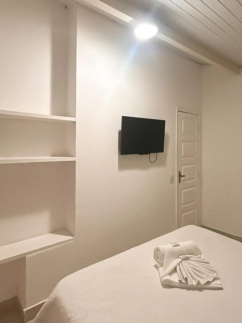Bed in Pousada Praia e Conforto