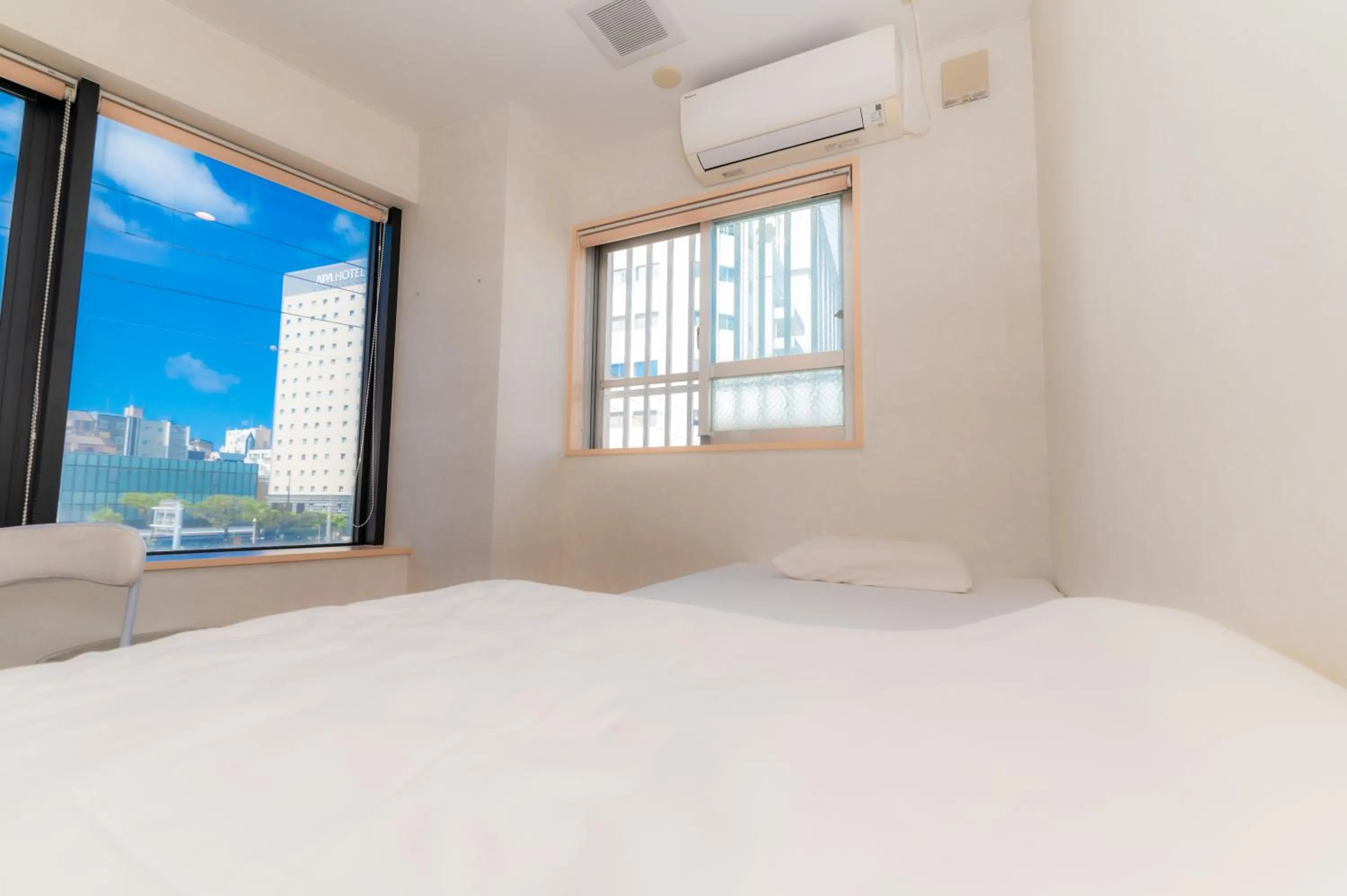 Photo of the whole room in Guest House Grand Naha