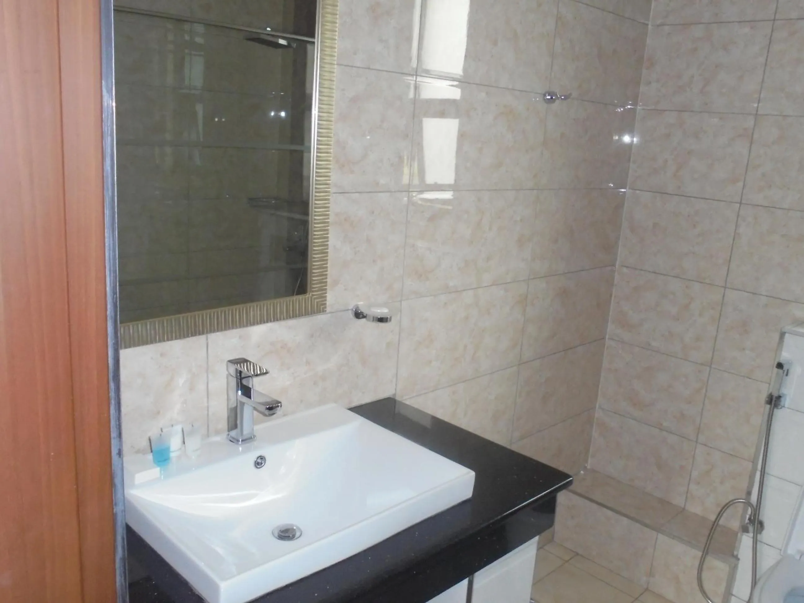 Bathroom in We Hotel and Suites