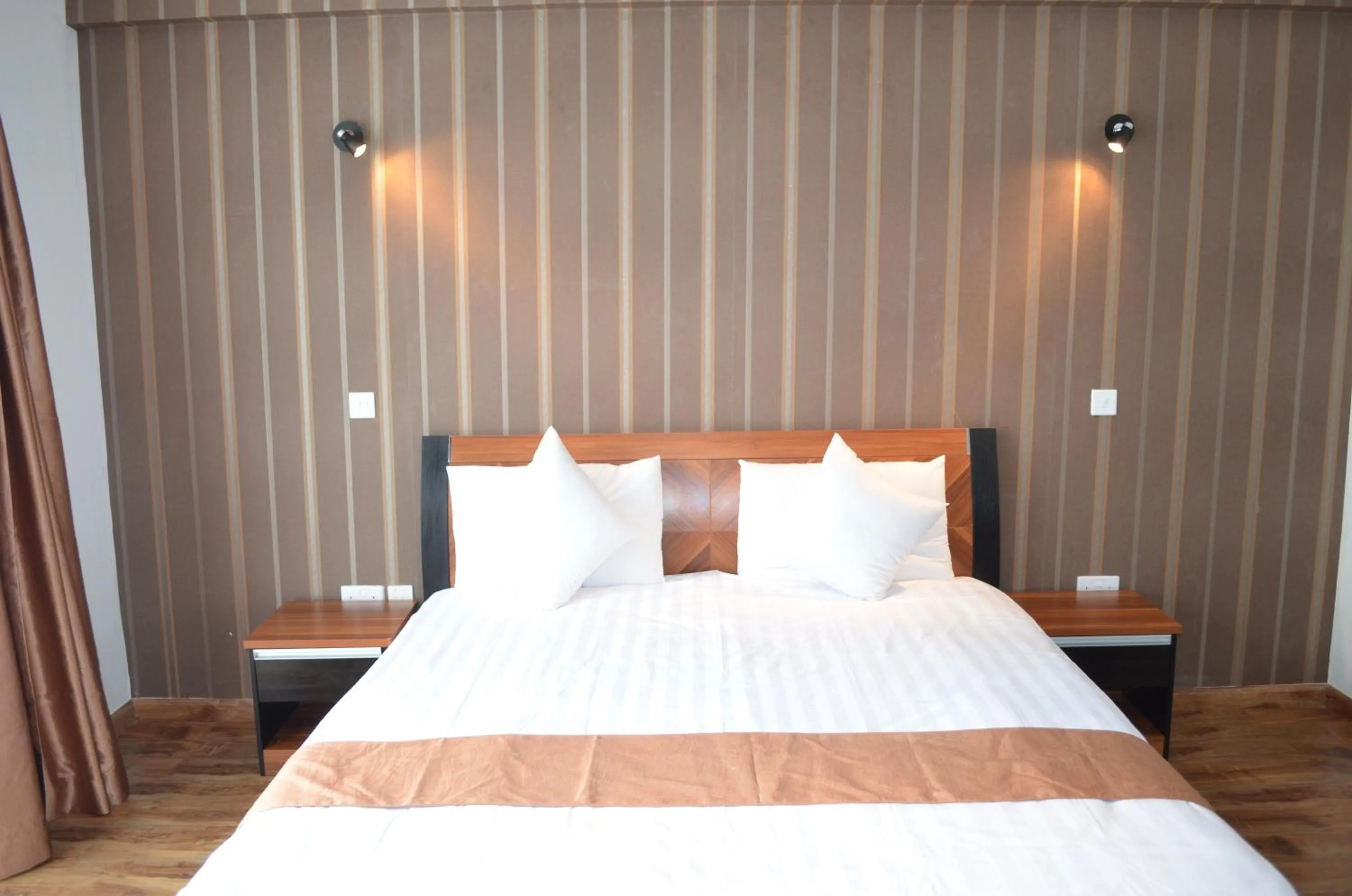 Bed in We Hotel and Suites