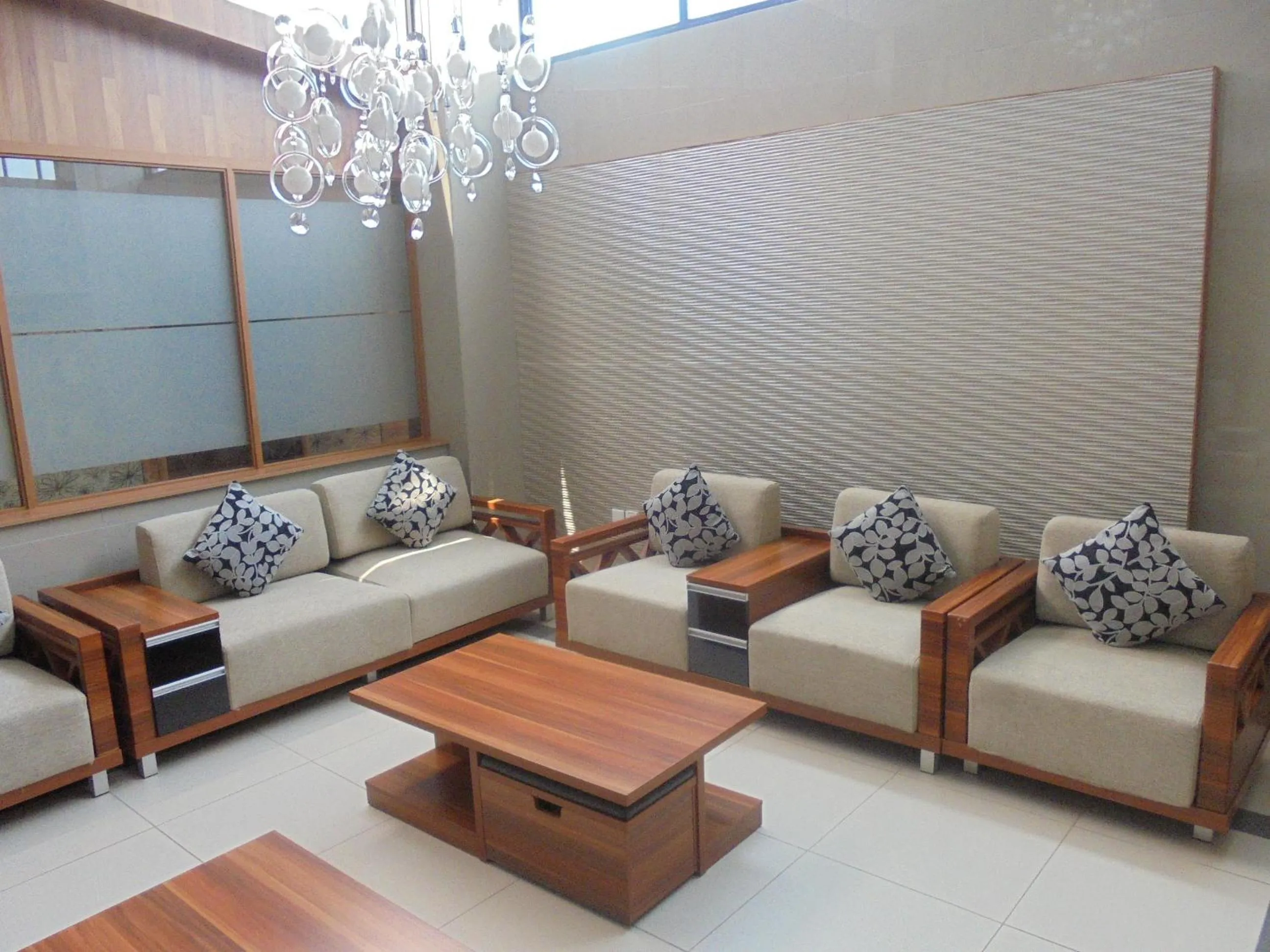 Communal lounge/ TV room in We Hotel and Suites