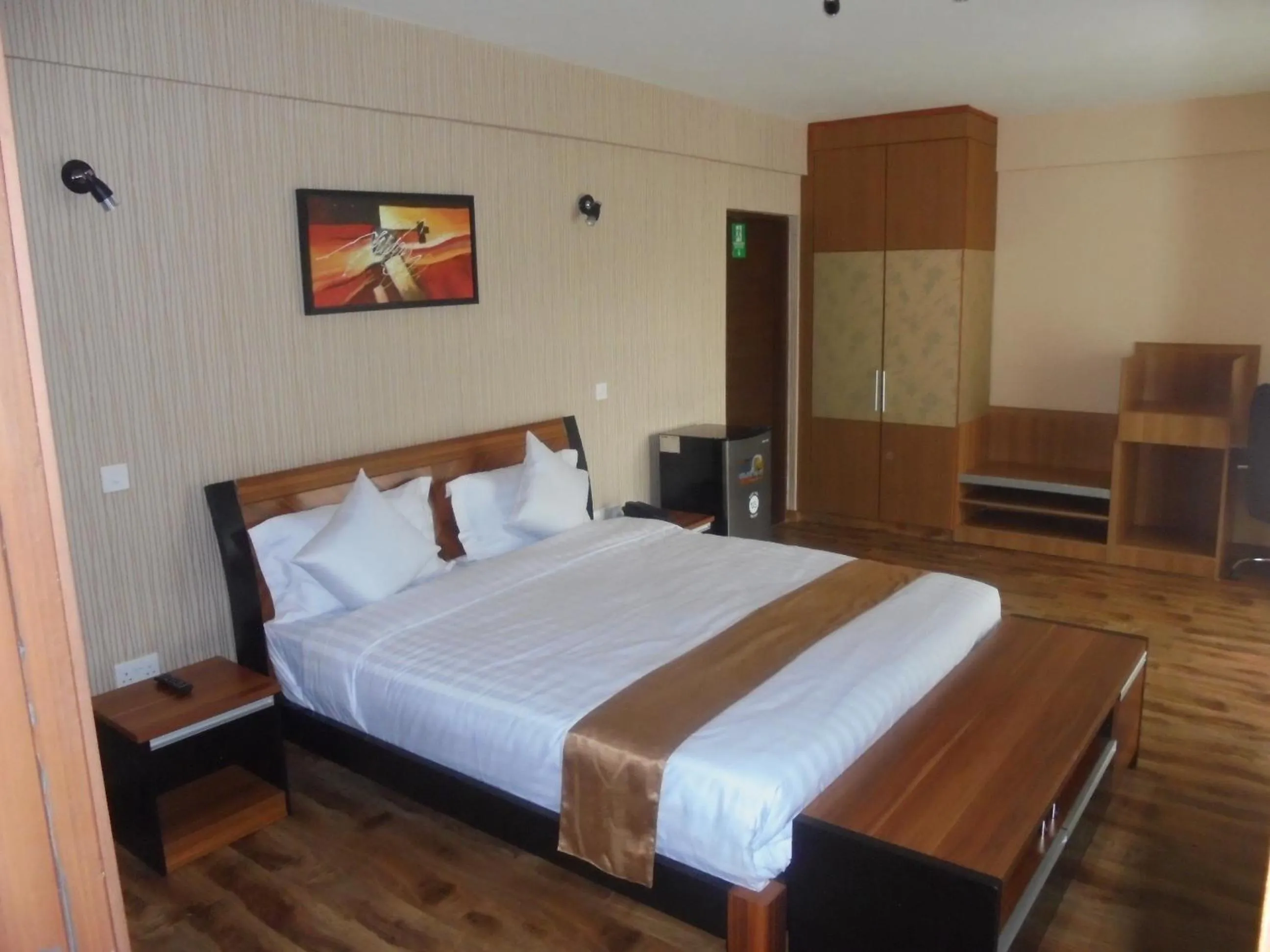 Bed in We Hotel and Suites