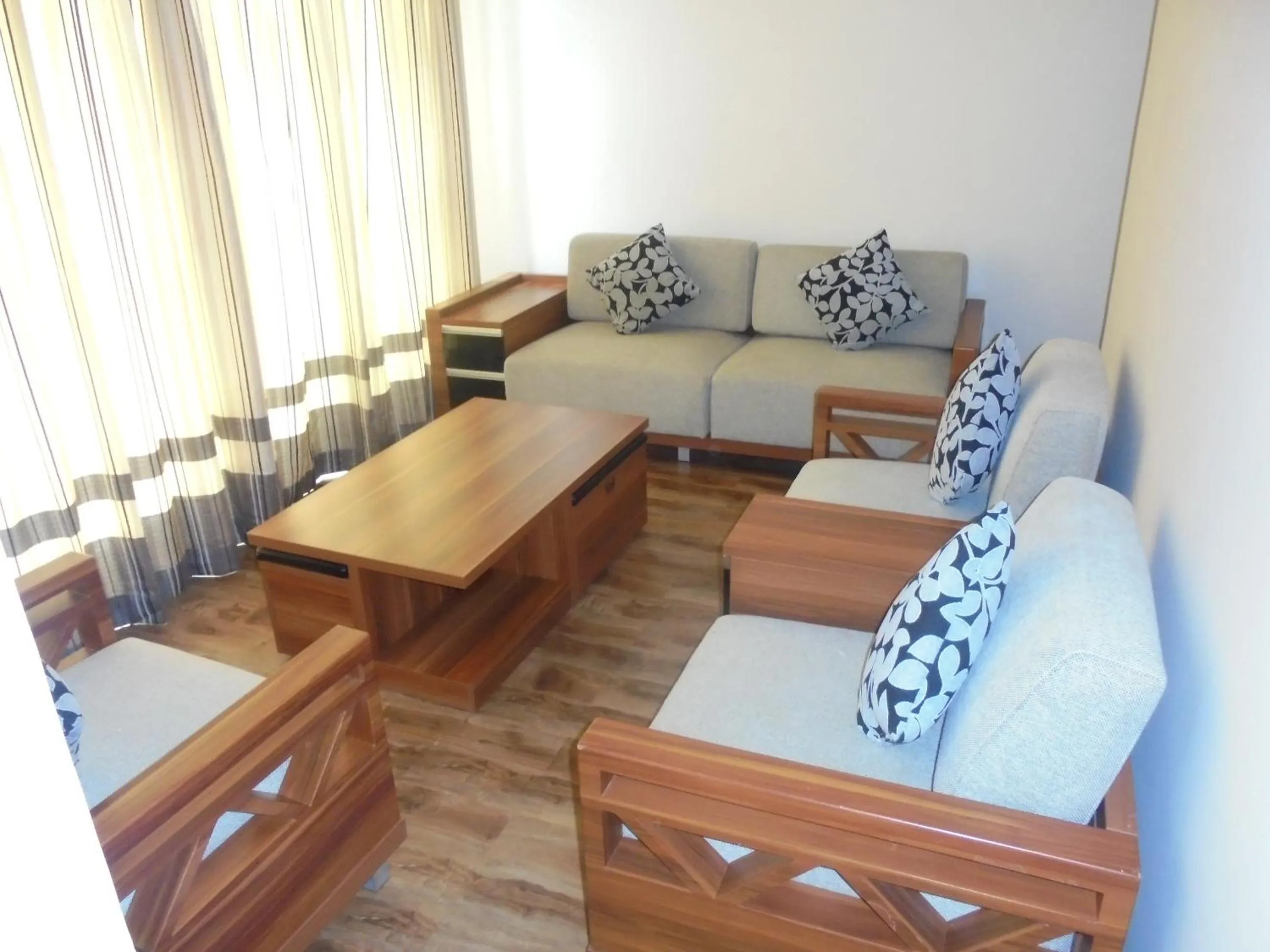 Communal lounge/ TV room in We Hotel and Suites