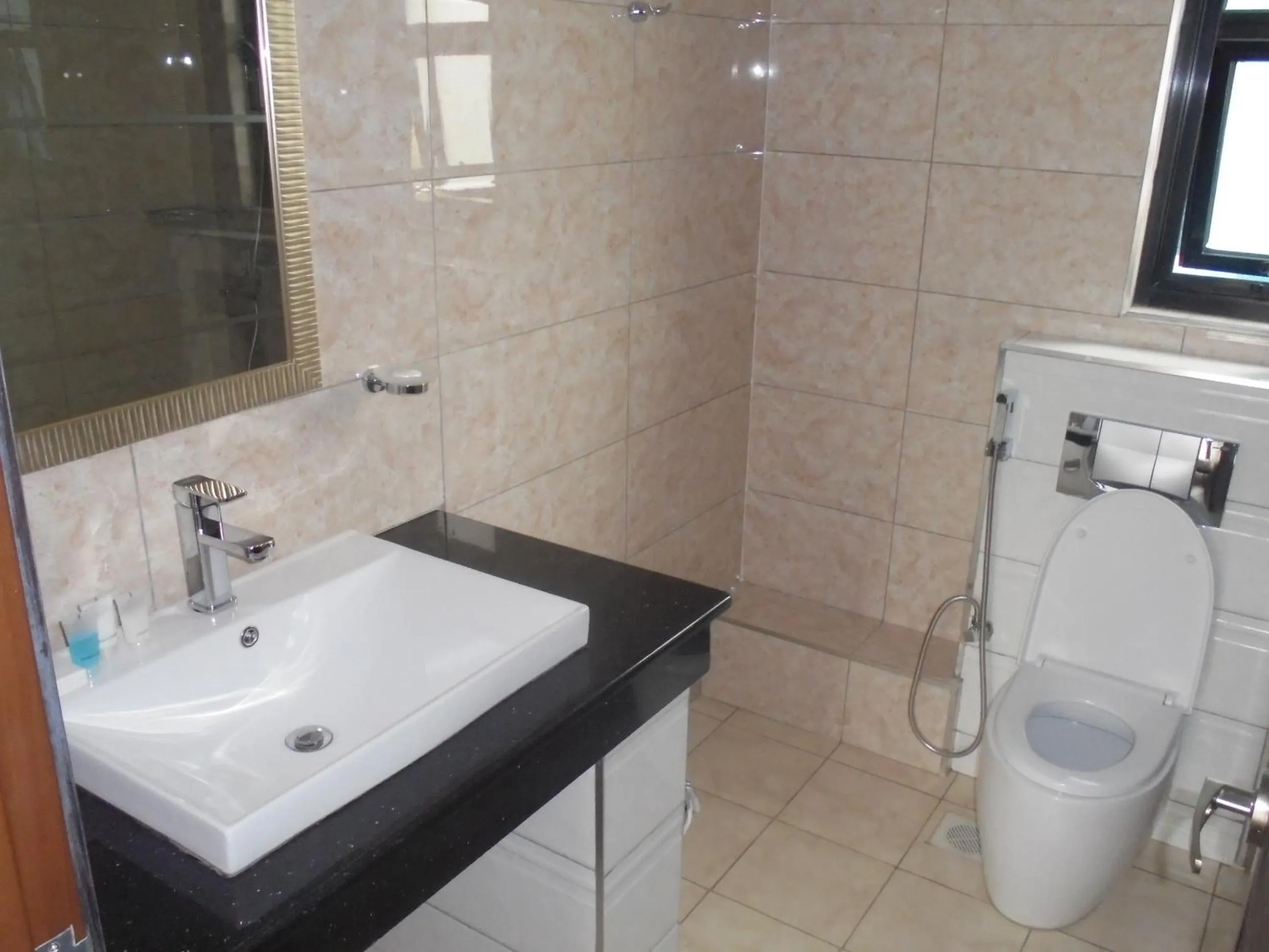 Bathroom in We Hotel and Suites