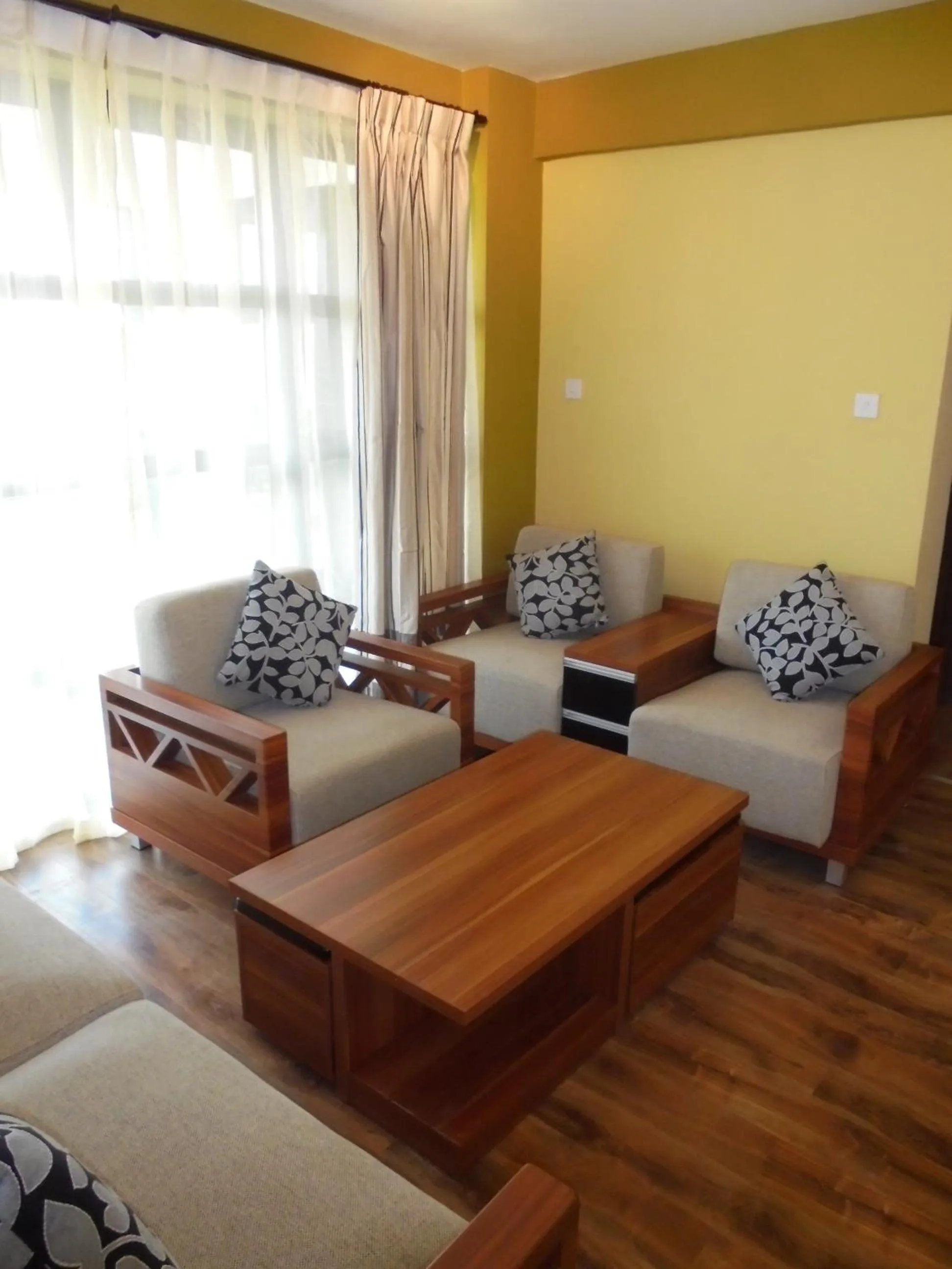 Communal lounge/ TV room in We Hotel and Suites