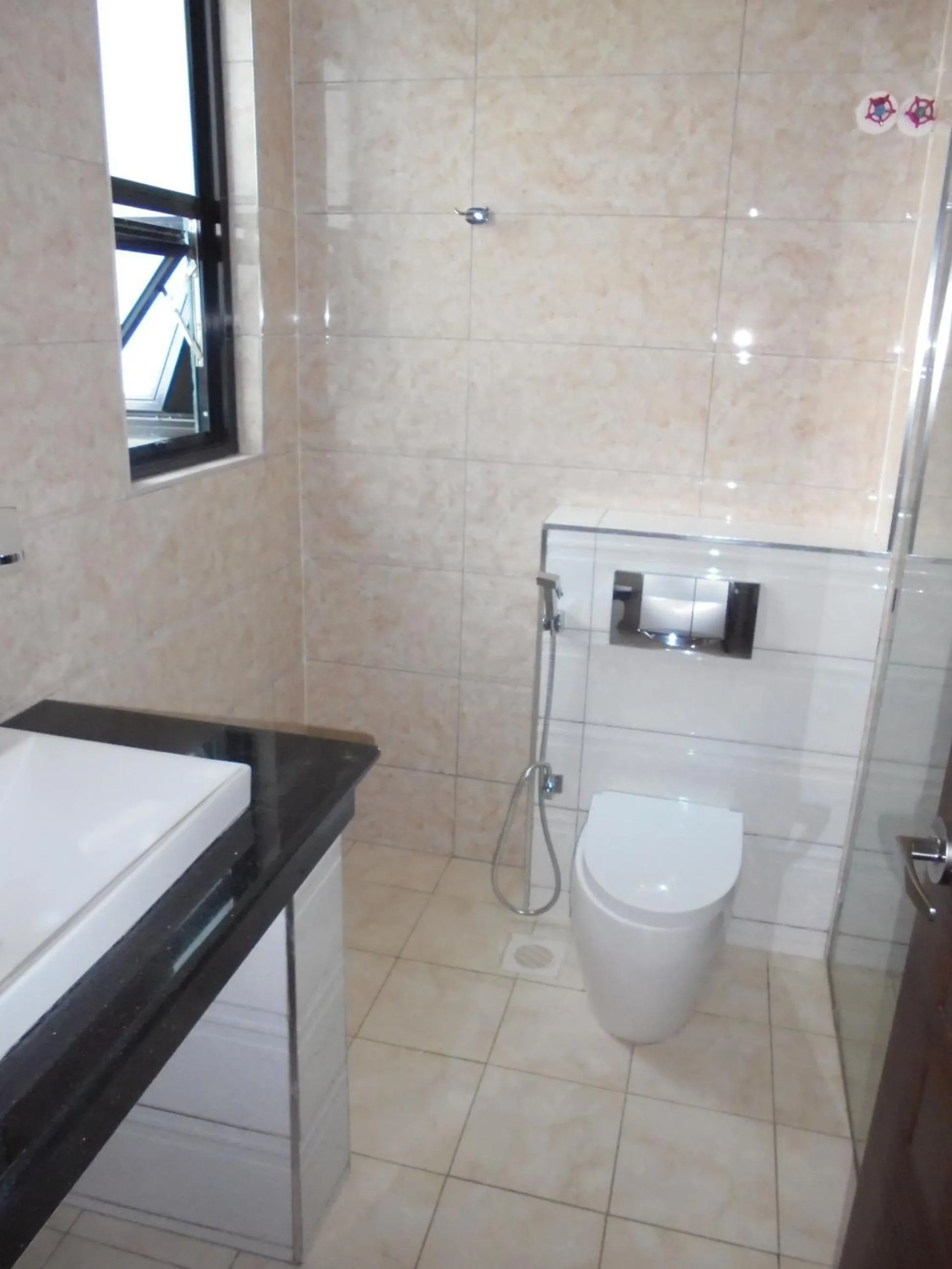 Bathroom in We Hotel and Suites