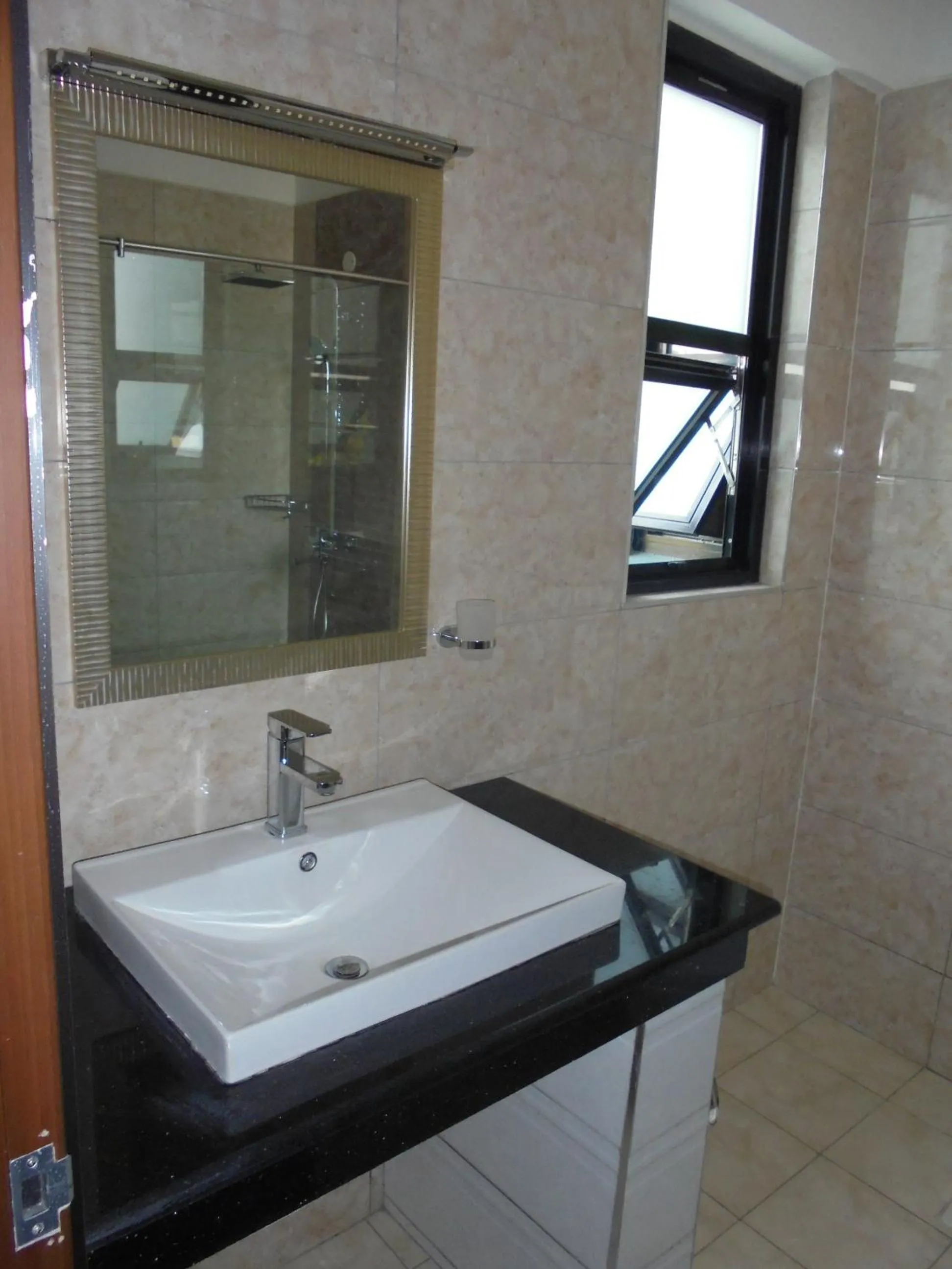 Bathroom in We Hotel and Suites