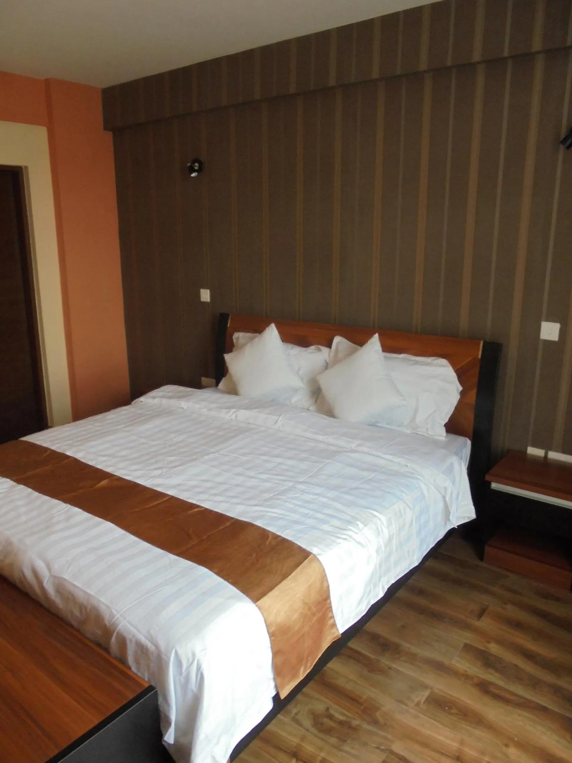 Bed in We Hotel and Suites