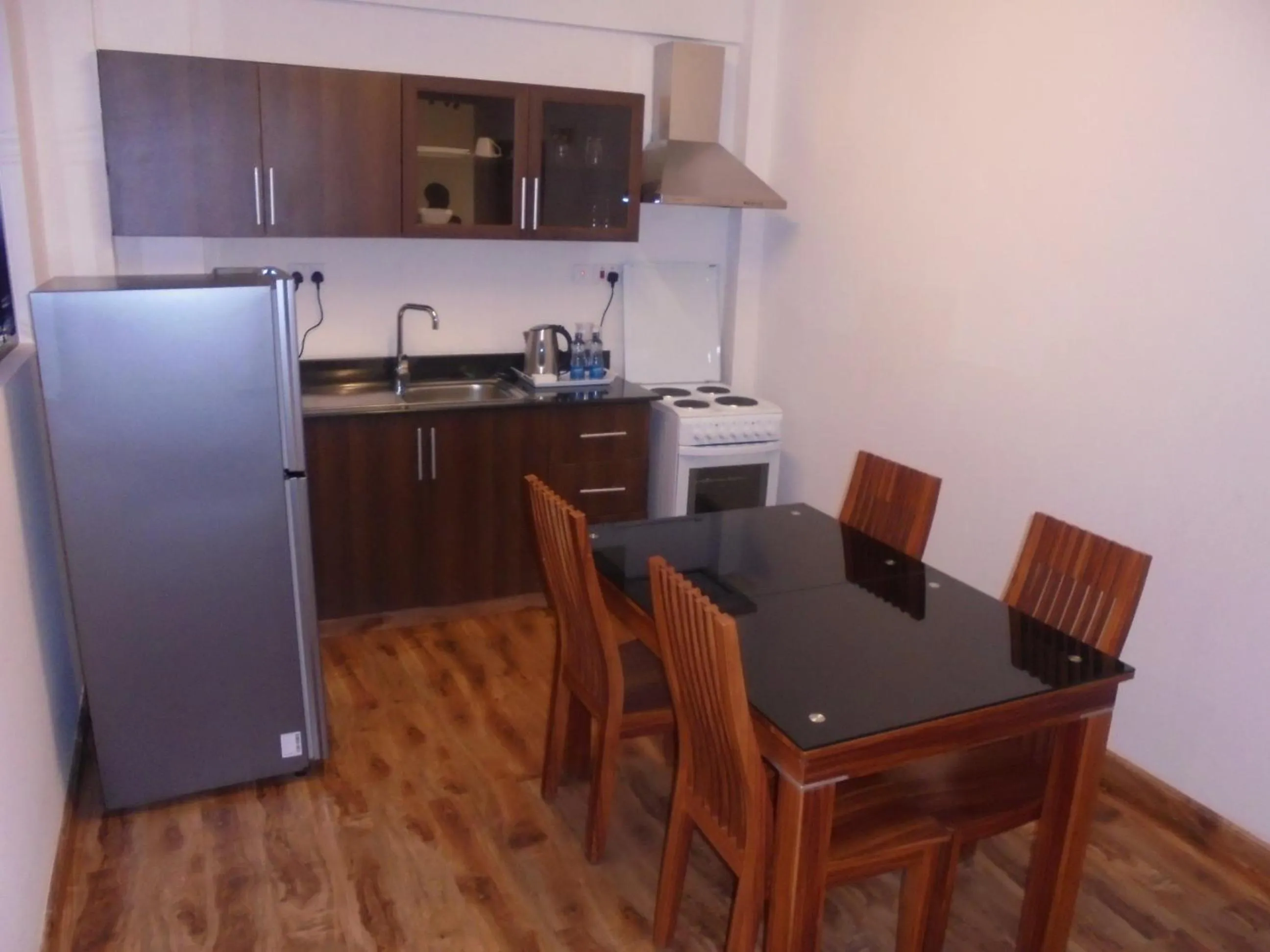 Kitchen or kitchenette in We Hotel and Suites