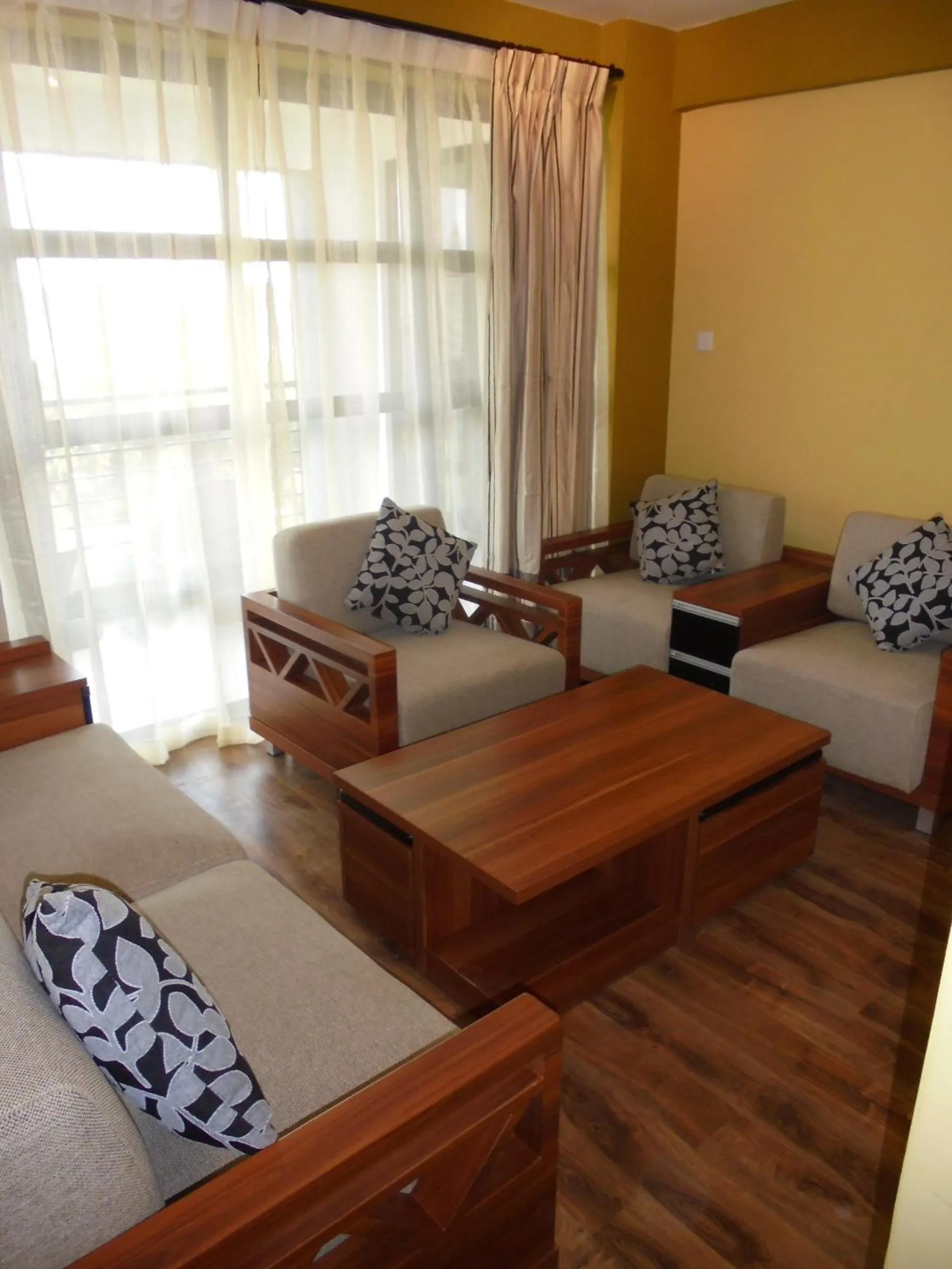 Communal lounge/ TV room in We Hotel and Suites