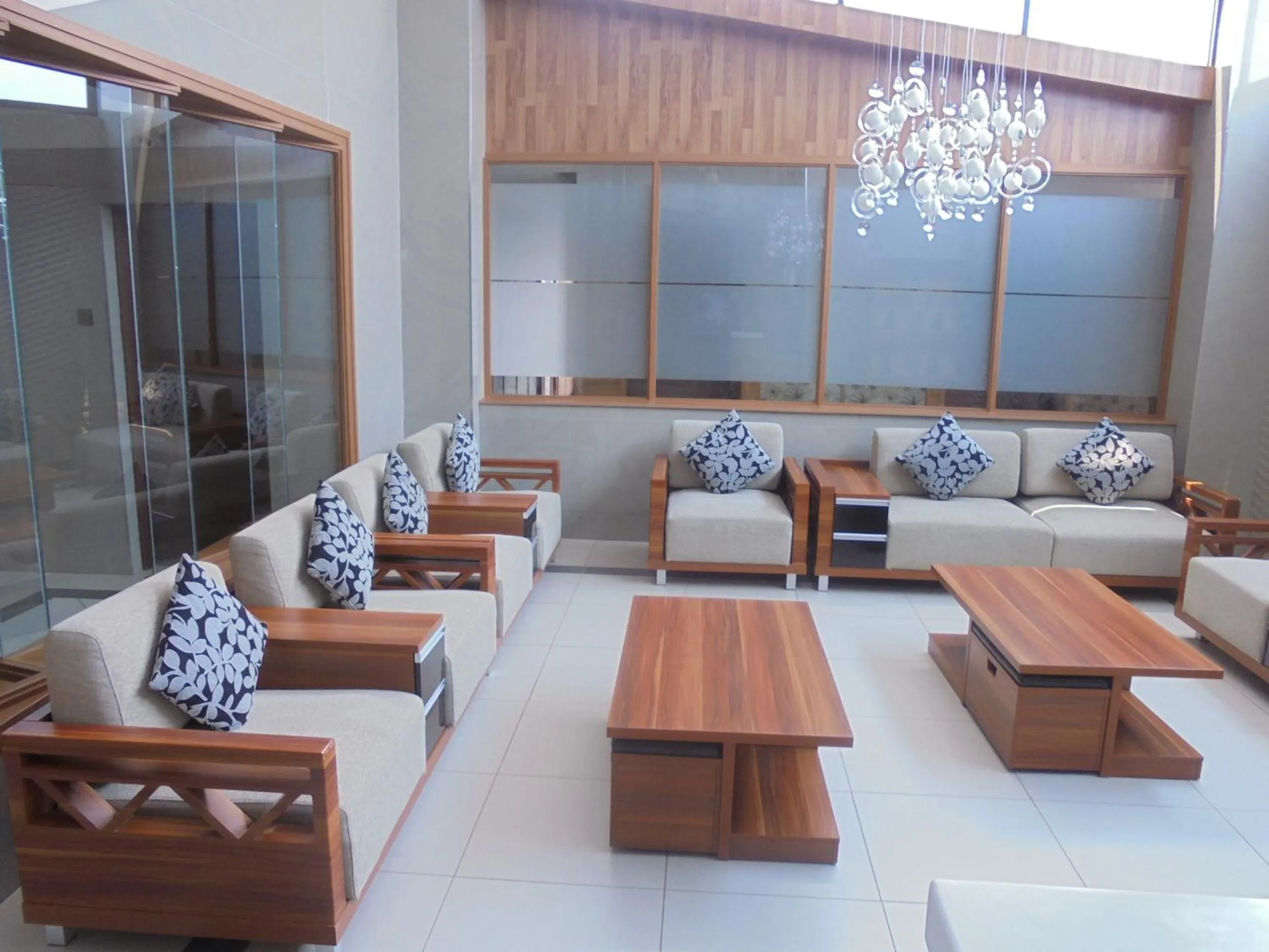 Communal lounge/ TV room in We Hotel and Suites