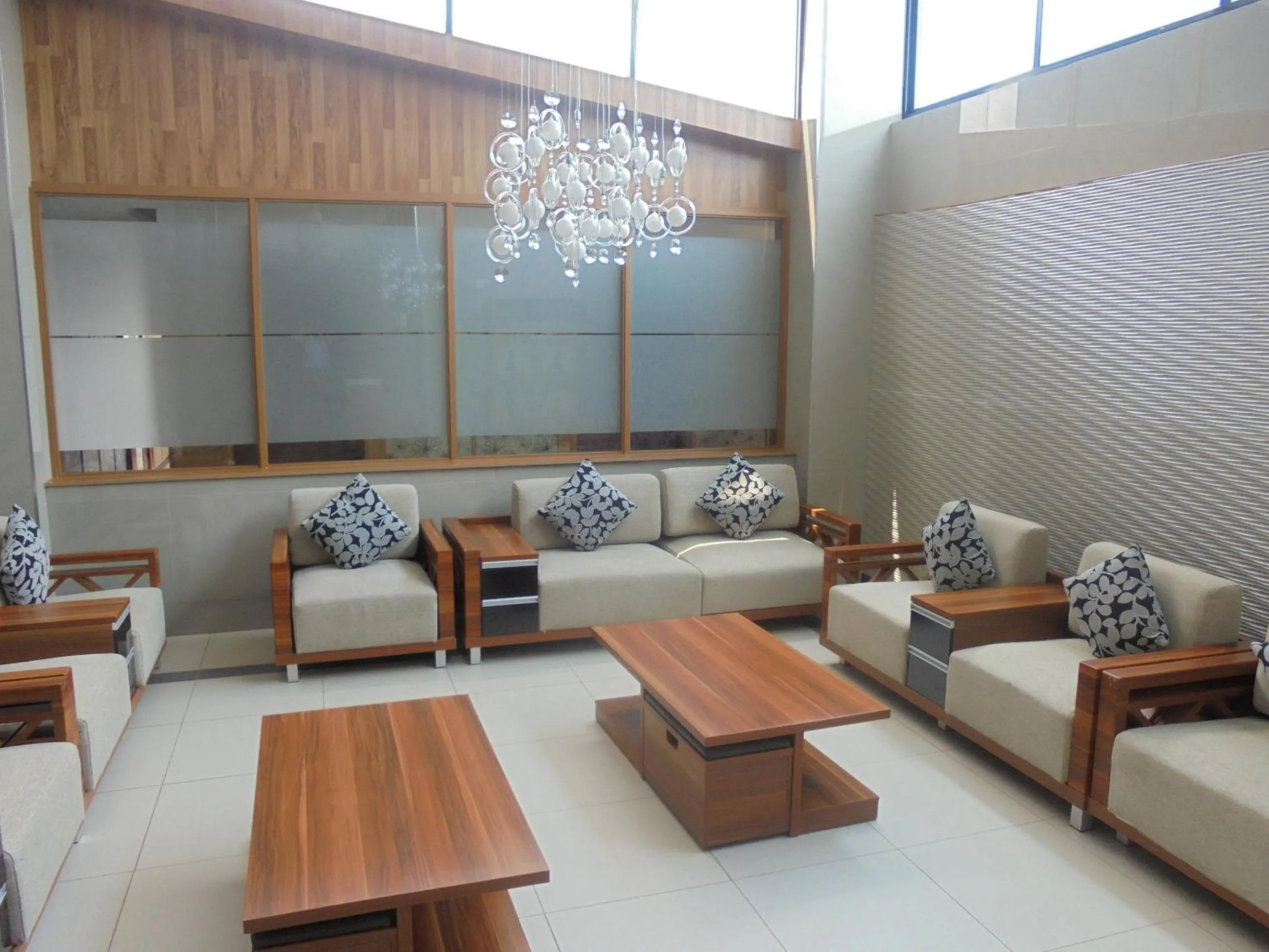 Communal lounge/ TV room in We Hotel and Suites