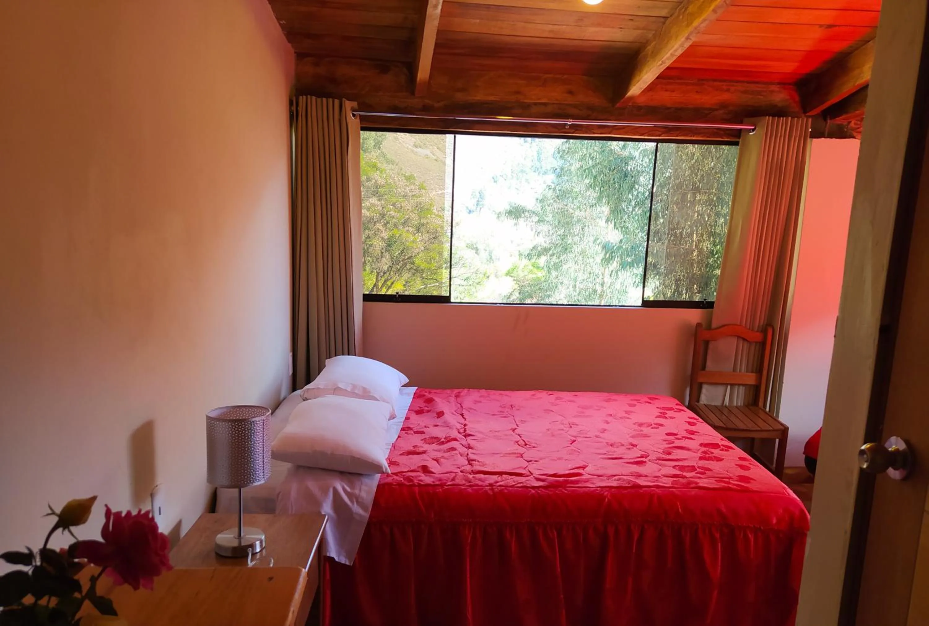 Bed in Tambo de Ollantay Hotel