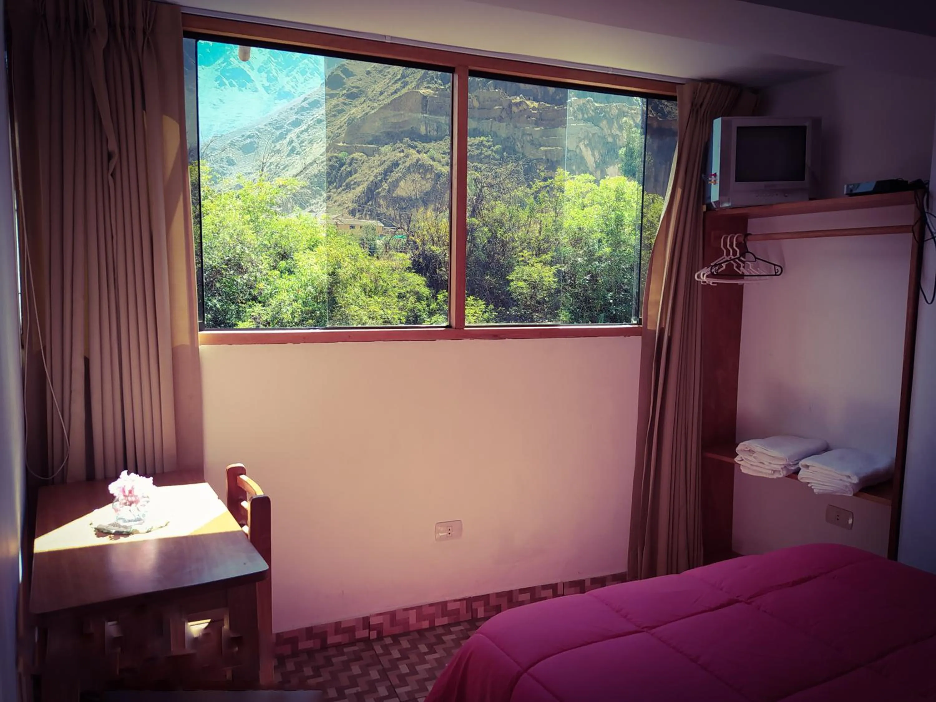 Bed in Tambo de Ollantay Hotel