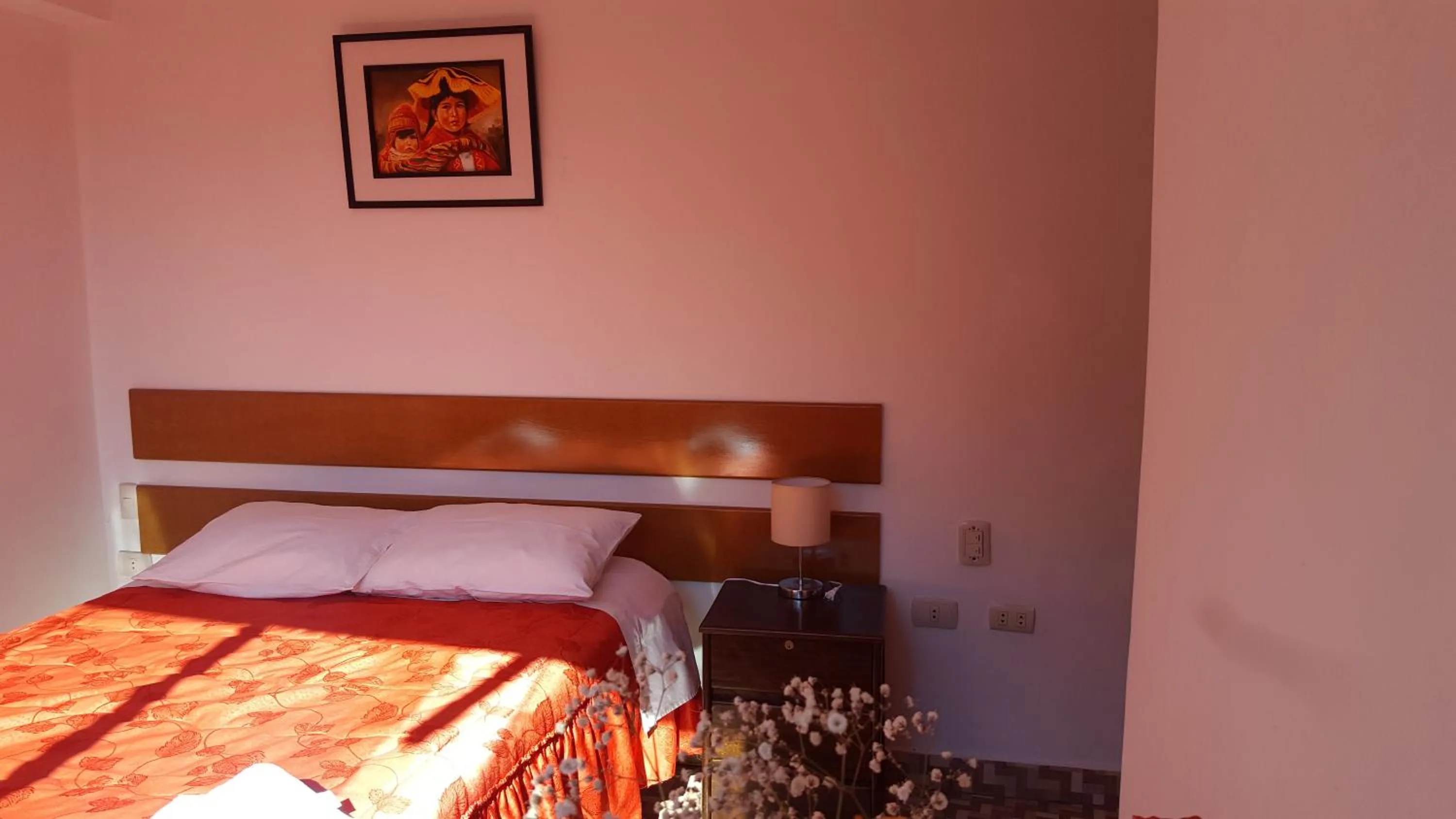 Bed in Tambo de Ollantay Hotel