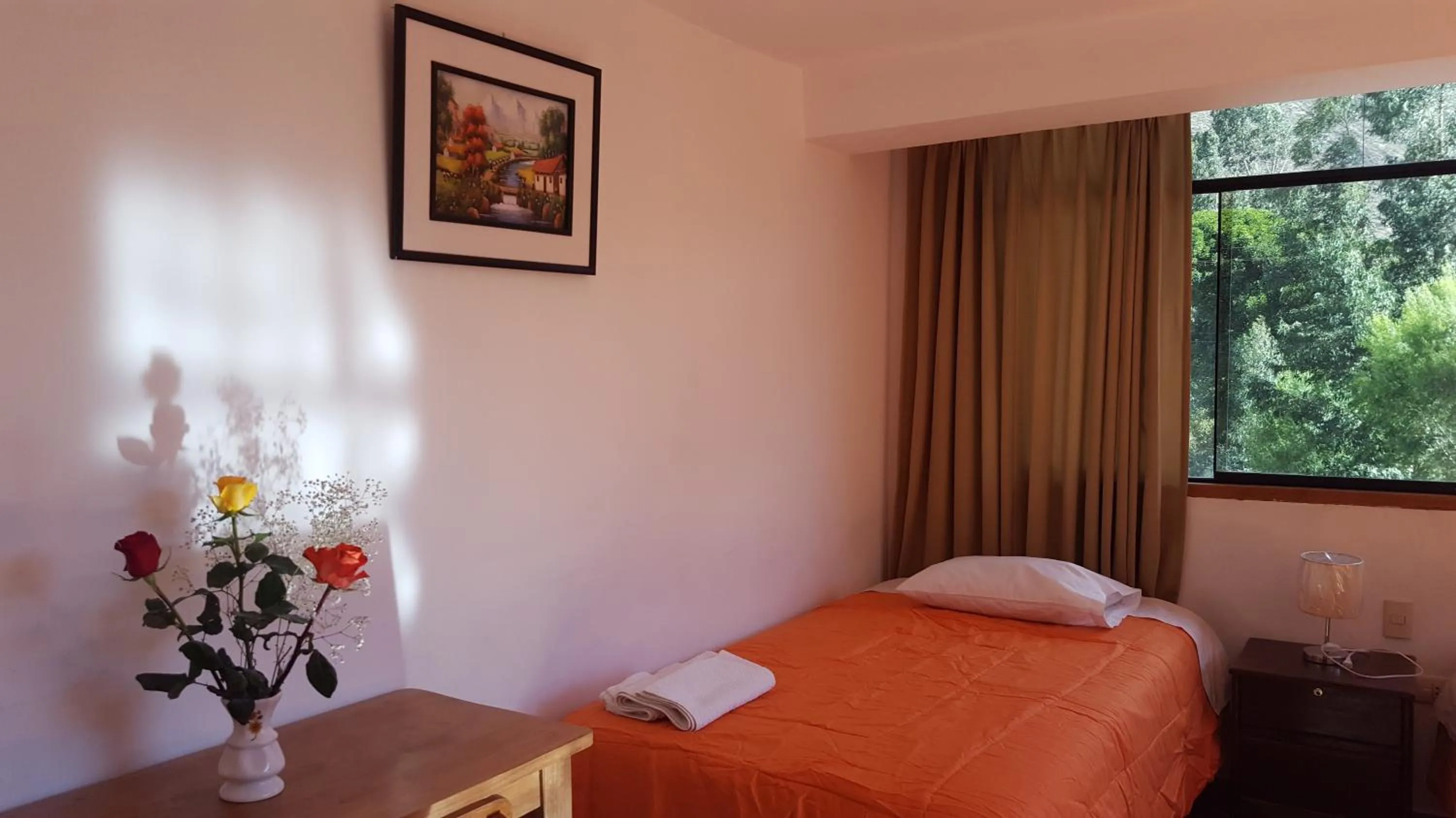 Bed in Tambo de Ollantay Hotel