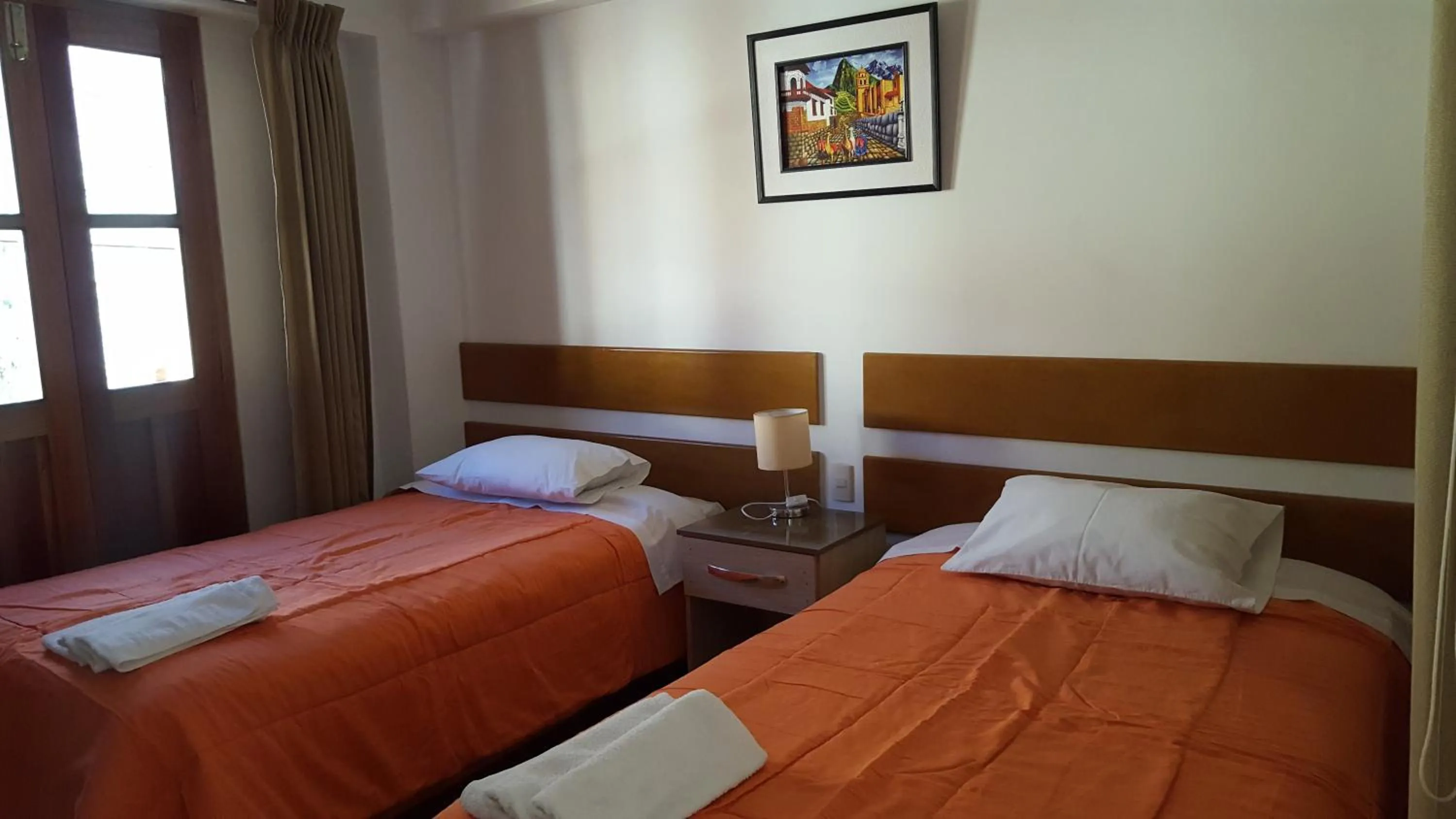 Bed in Tambo de Ollantay Hotel