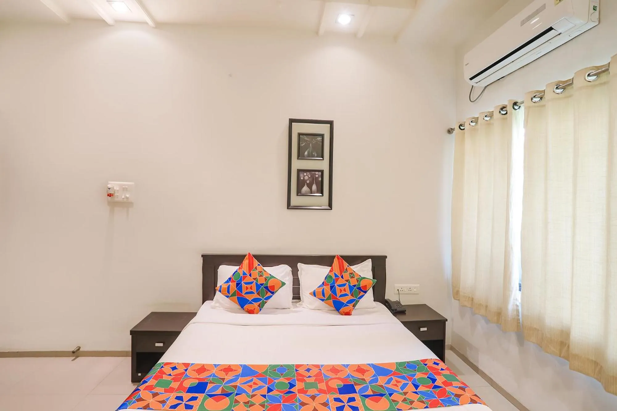 Bed in FabHotel Archanil Apartment - Sitanagar Cricket Ground