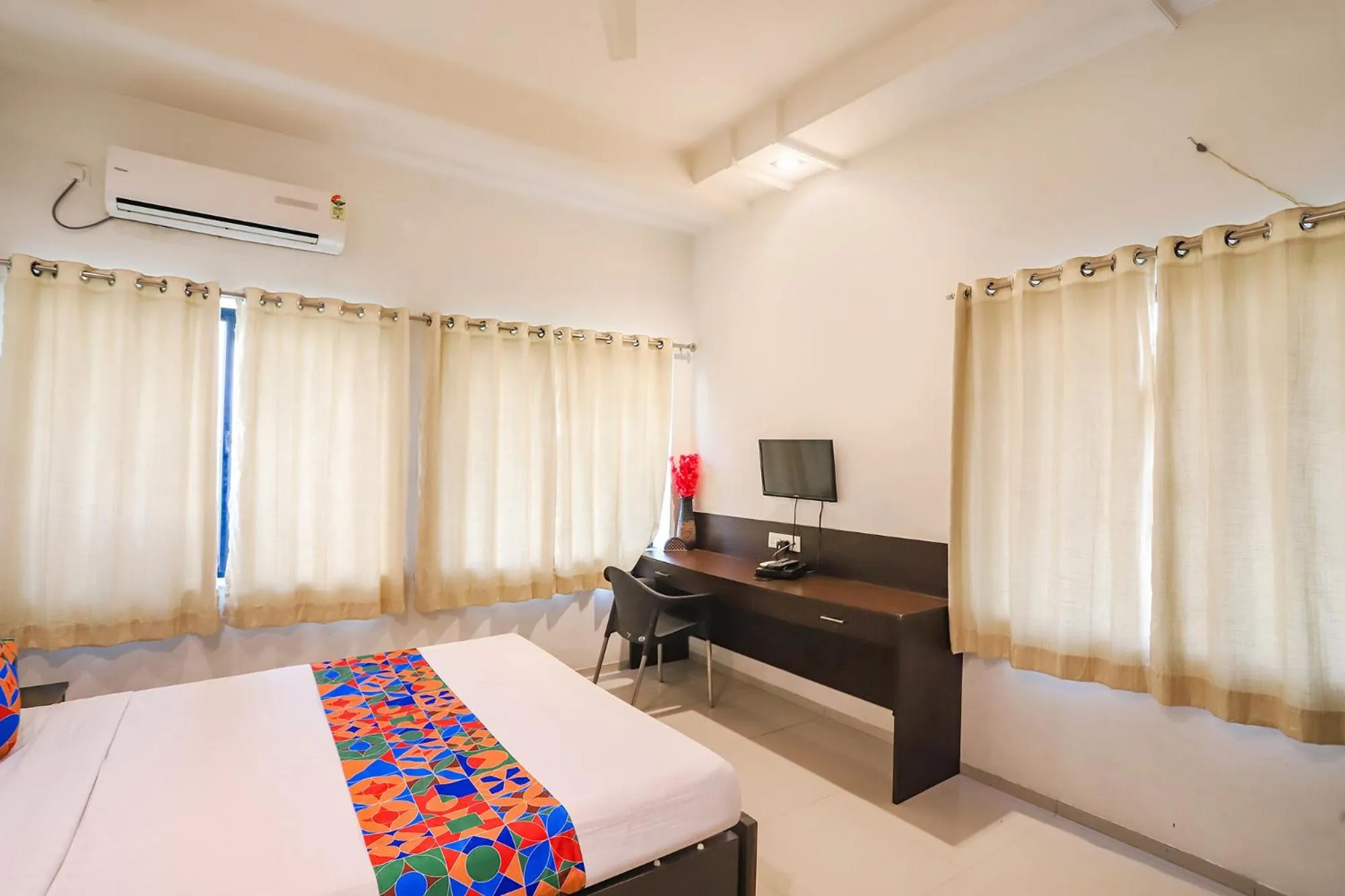 Bed in FabHotel Archanil Apartment - Sitanagar Cricket Ground