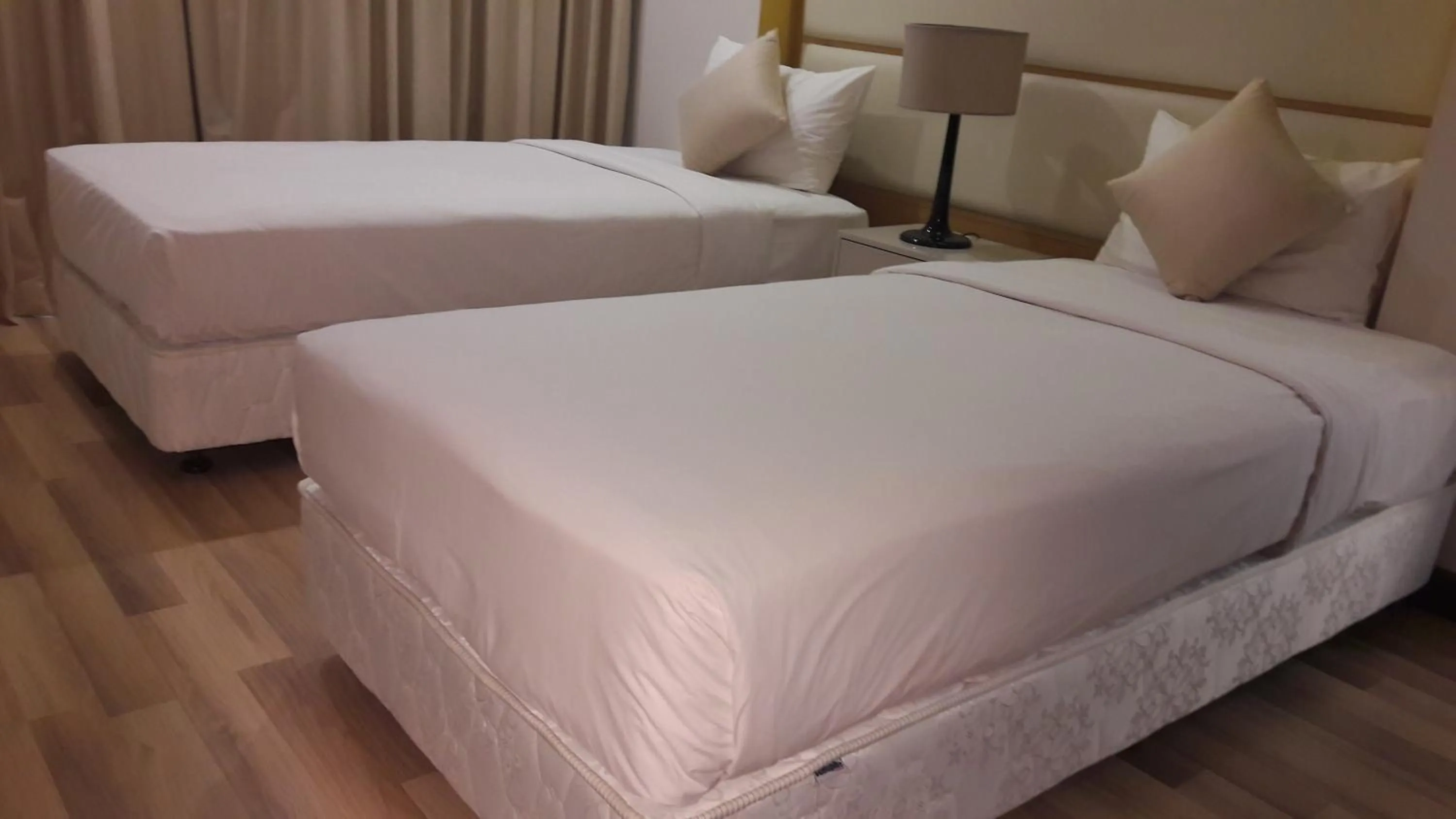 Bed in Bluesky Serviced Apartment Airport Plaza