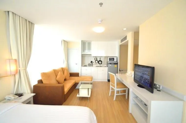 Communal lounge/ TV room in The City Hotel Sriracha by BBH Japan