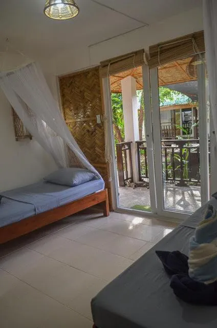 Bed in Blue Lagoon Dive Resort