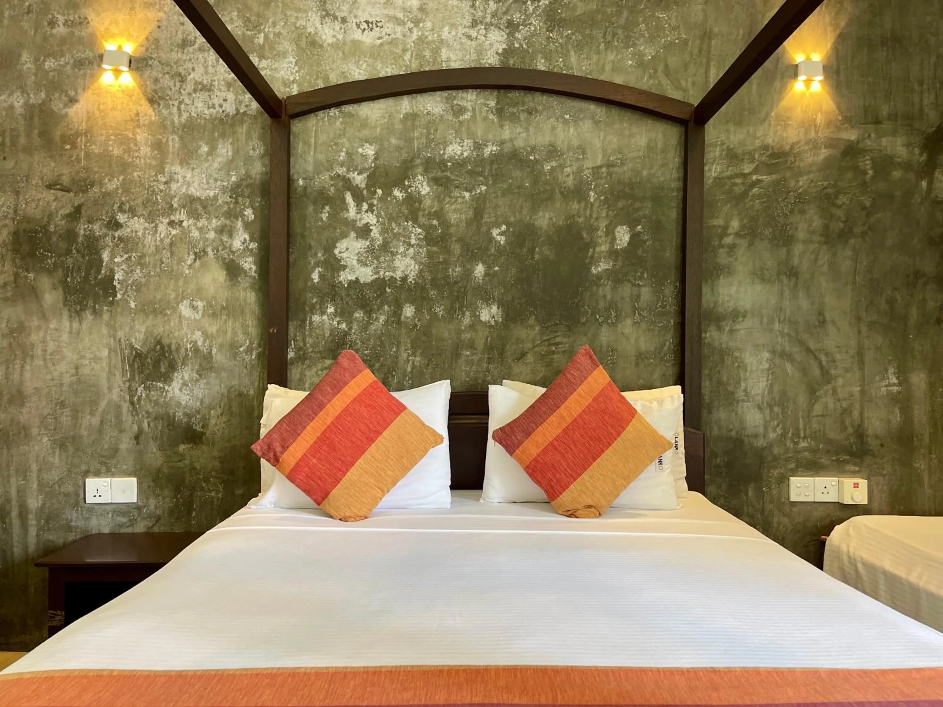 Bed in Olanro Hotel Negombo