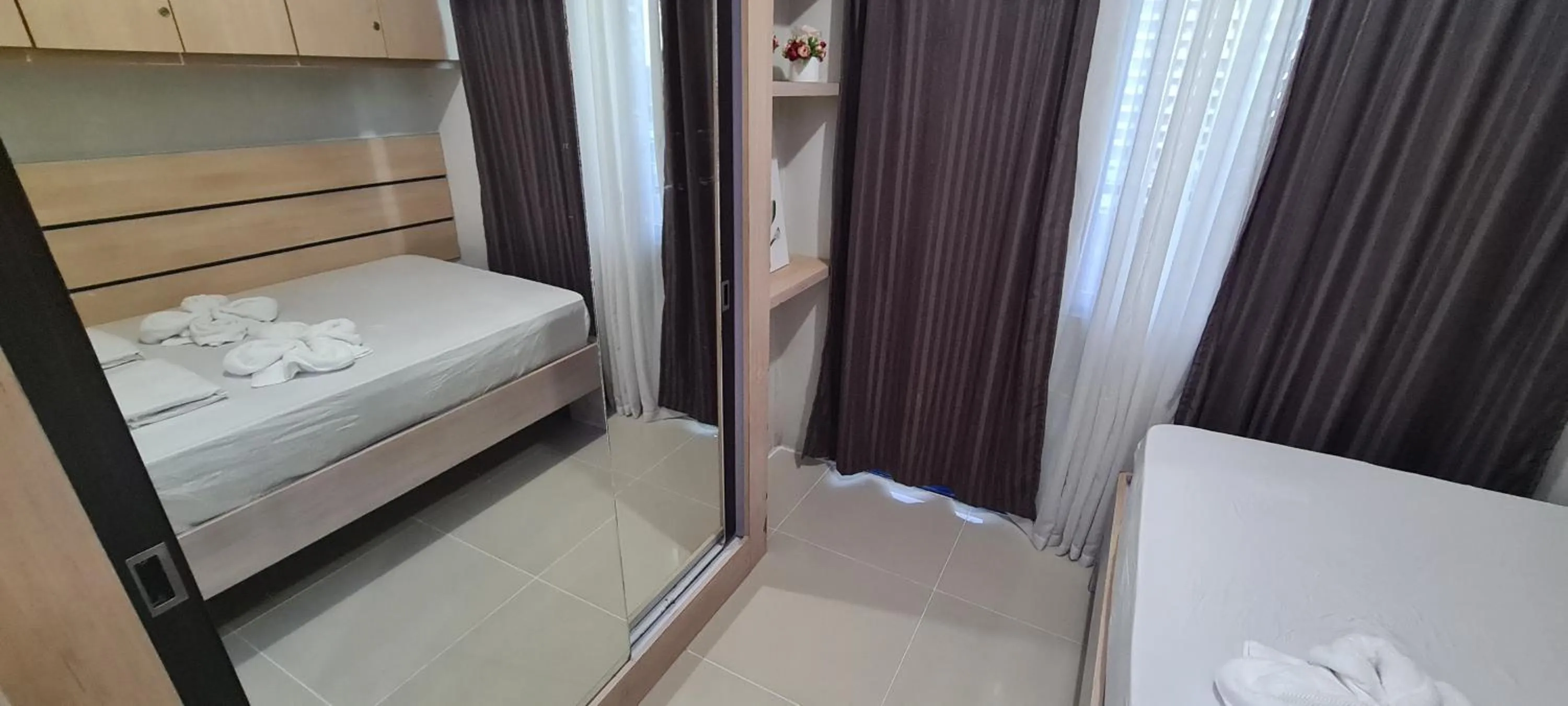 Bed in CondoDeal at Sea Residences