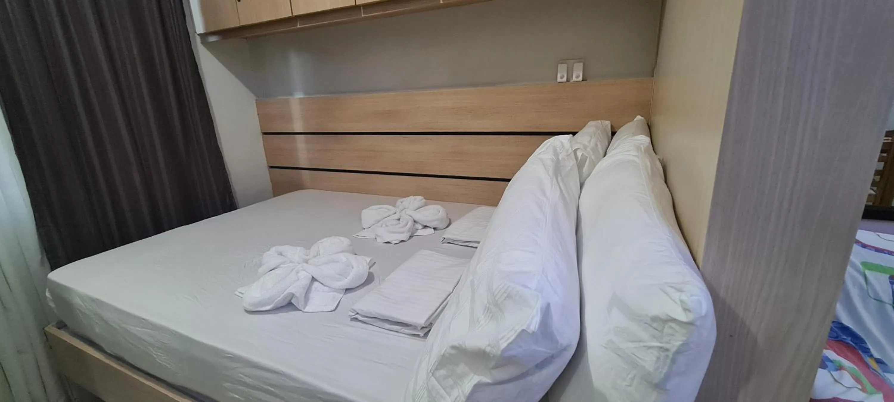 Bed in CondoDeal at Sea Residences