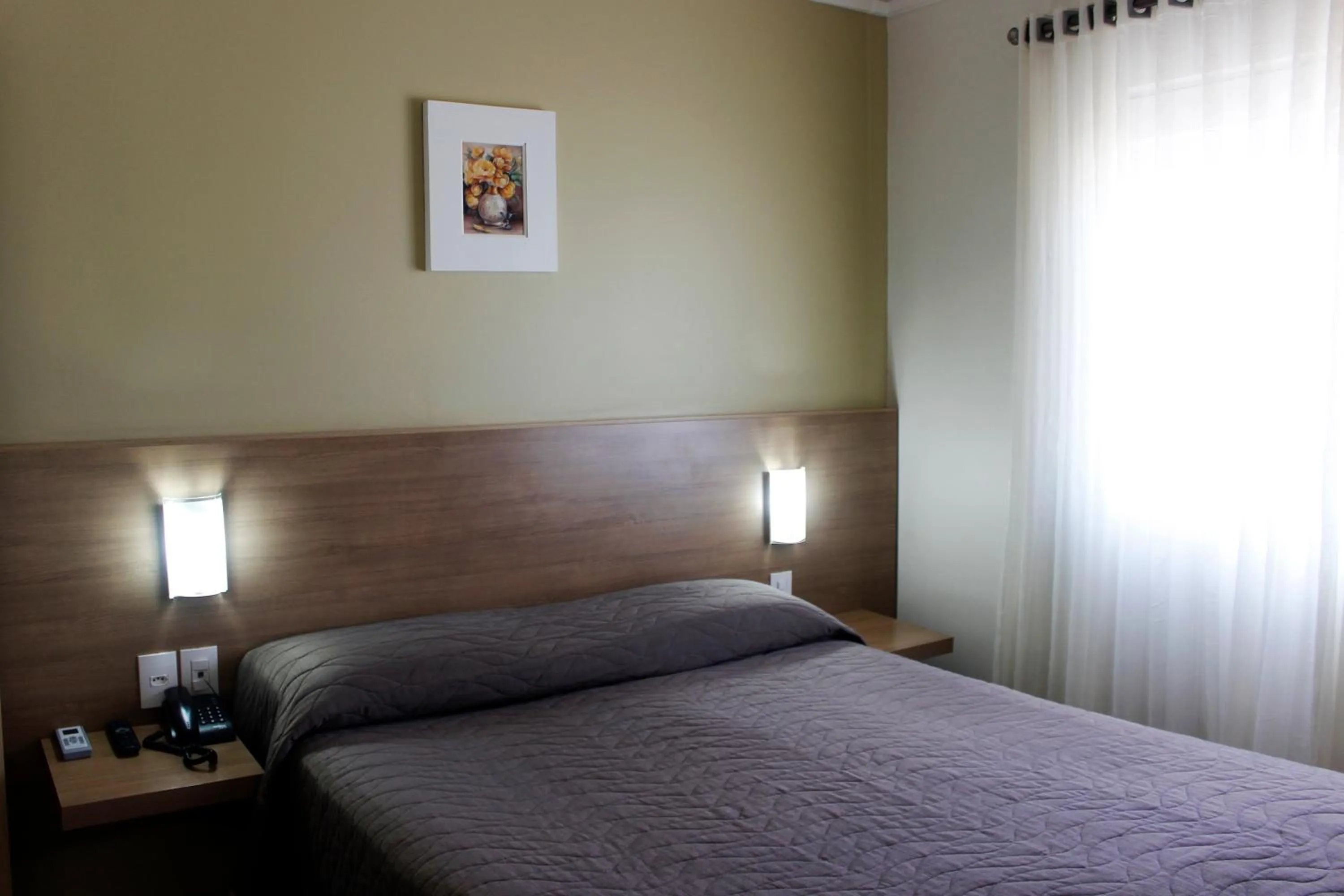 Bed in Francisco Beltrão Palace Hotel