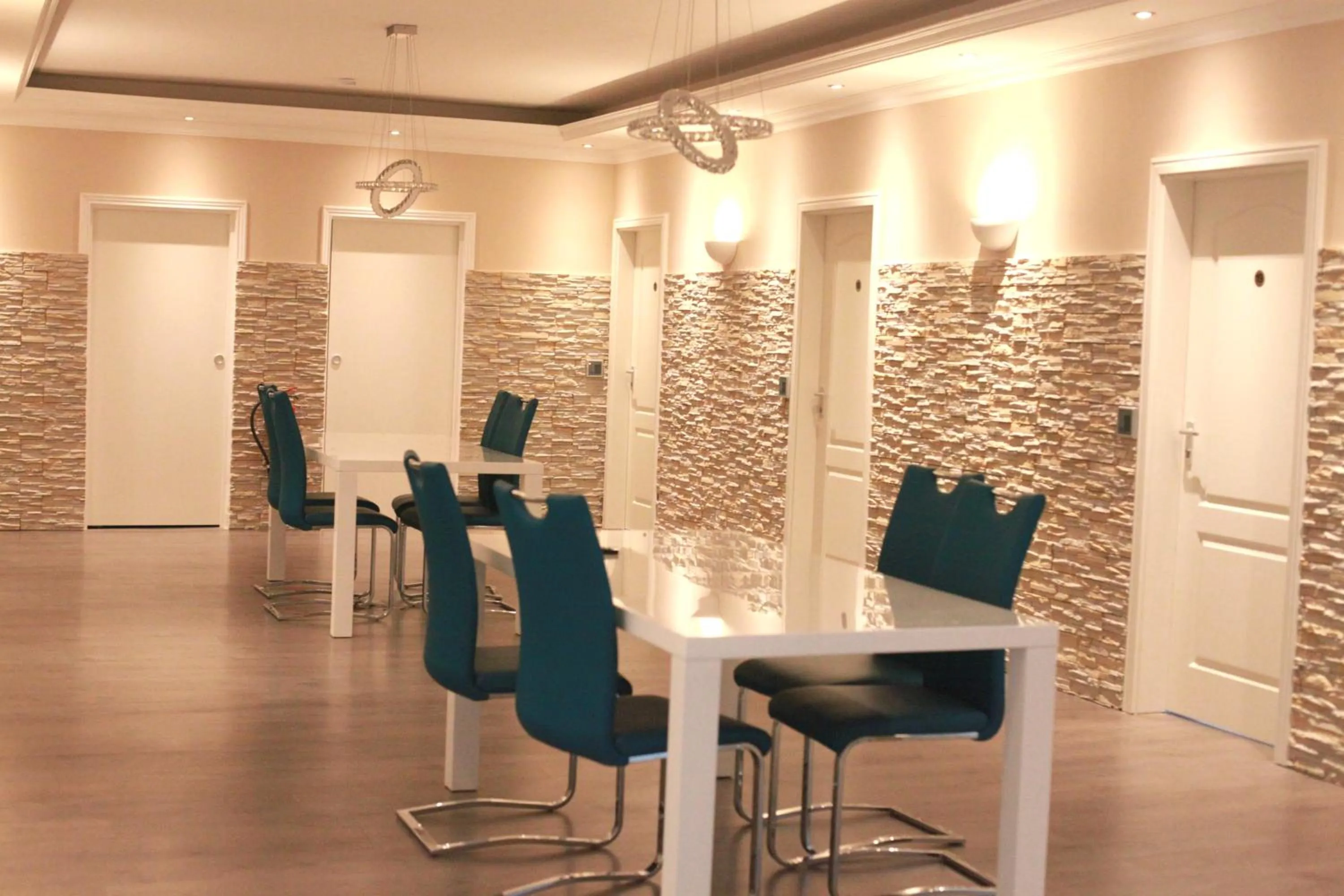 Communal lounge/ TV room in MAC City Hostel