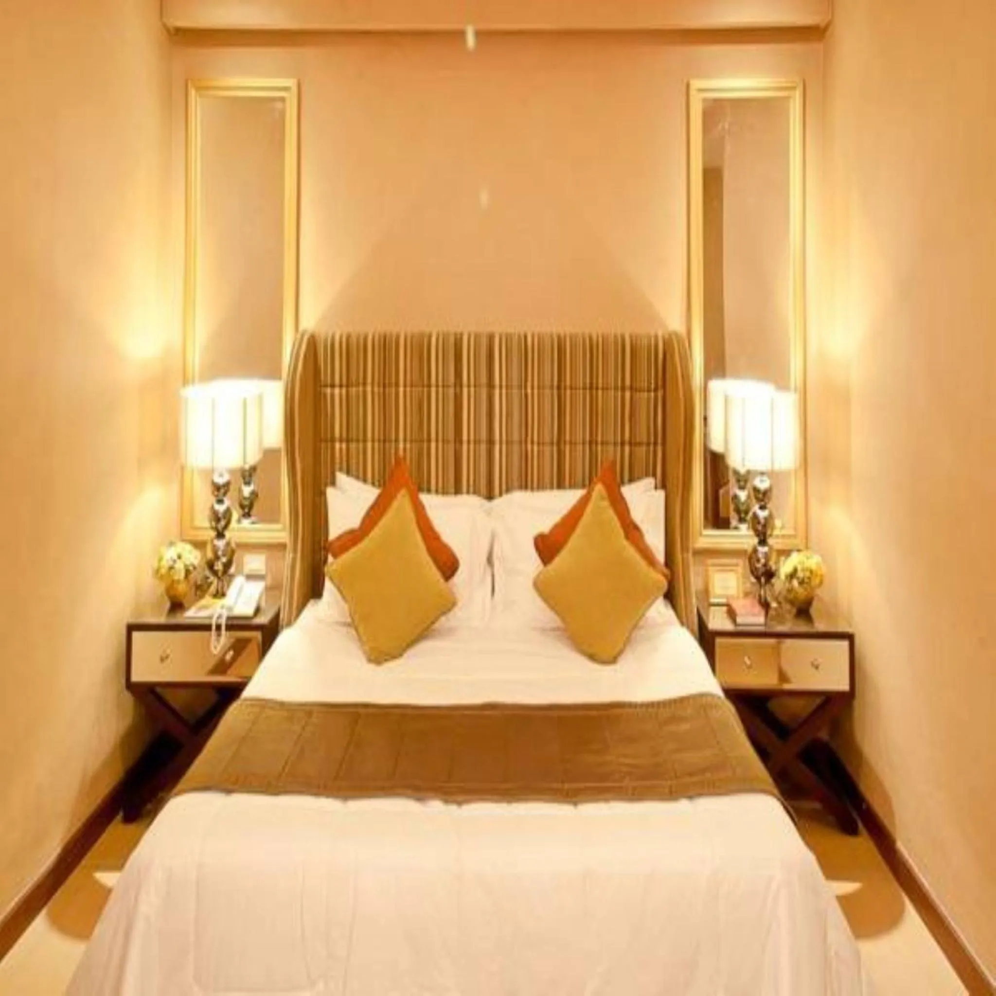 Bed in Royal Garden Hotel