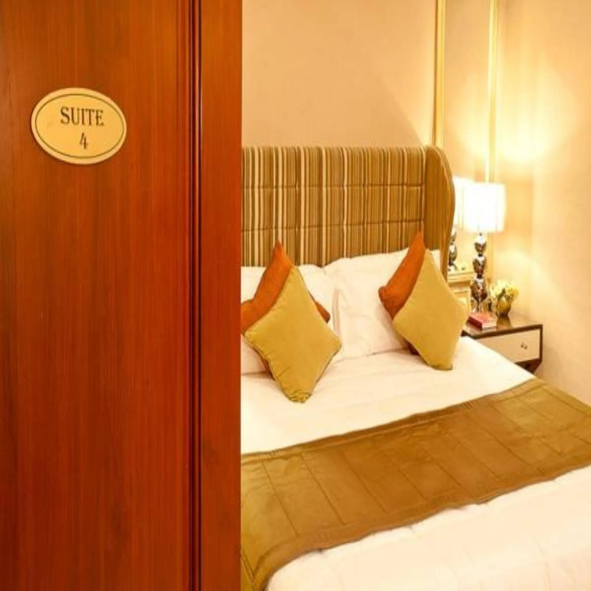 Bed in Royal Garden Hotel