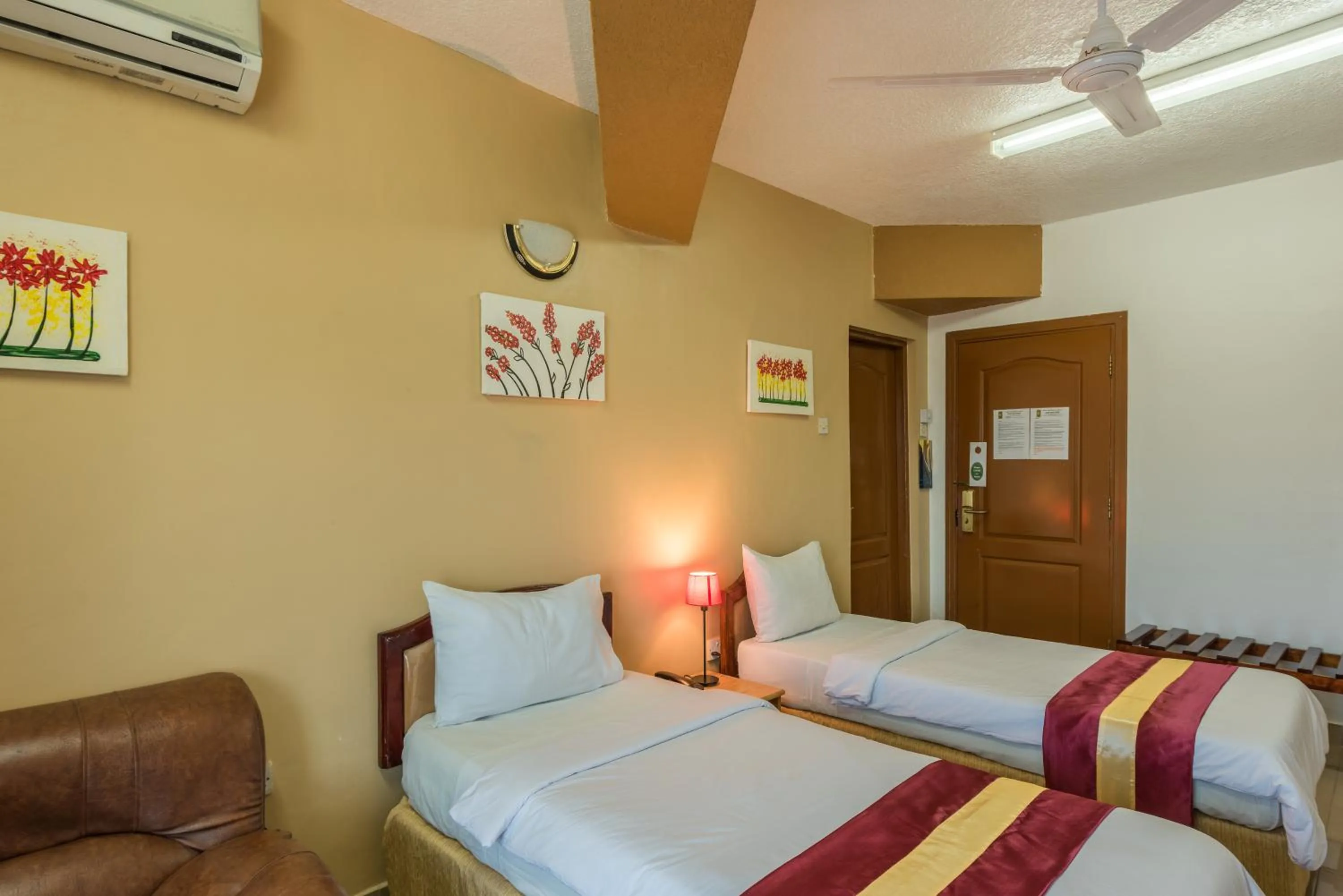 Bed in Hotel Raha Tower