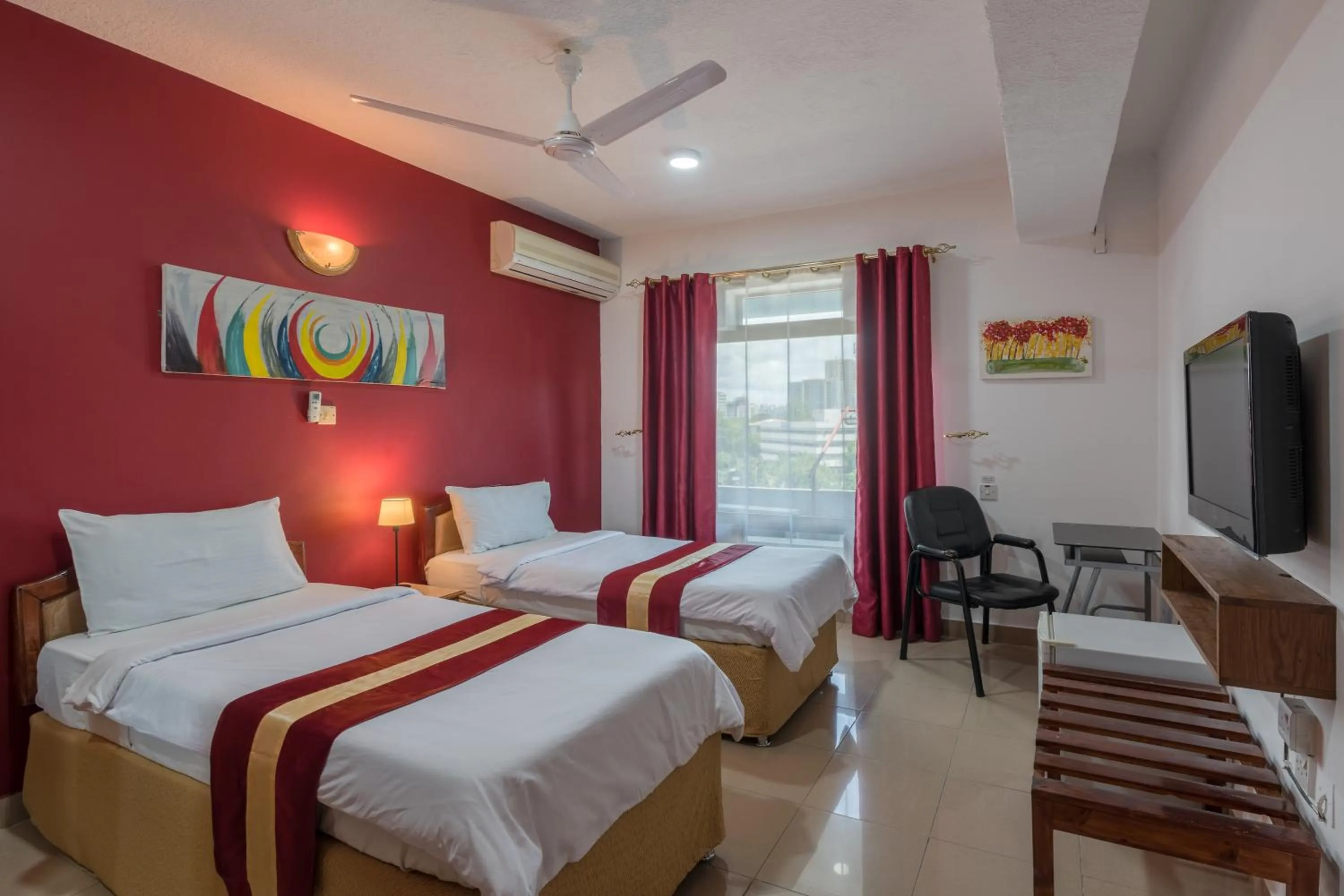 Bed in Hotel Raha Tower