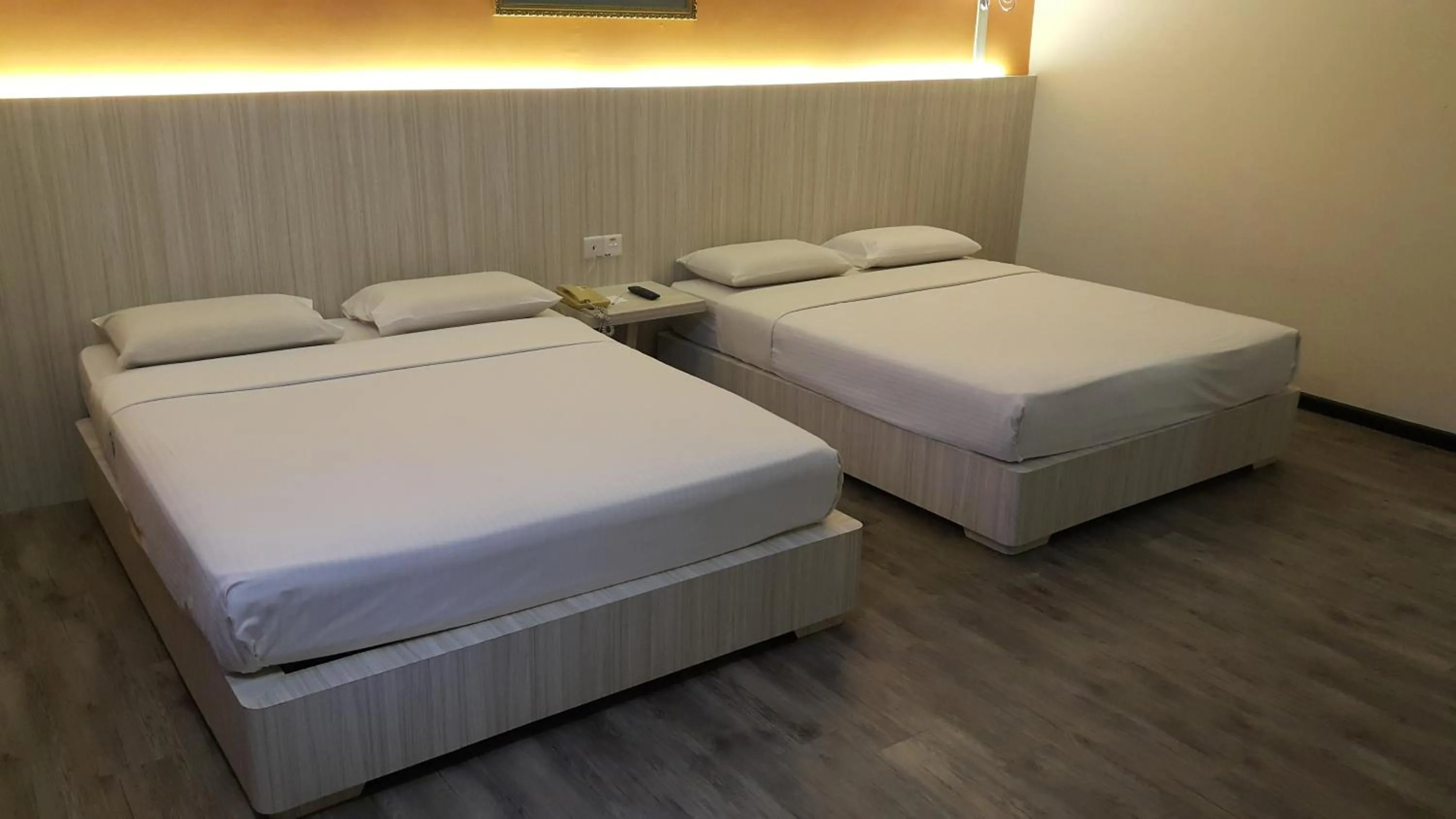 Bed in Red Rock Hotel Penang