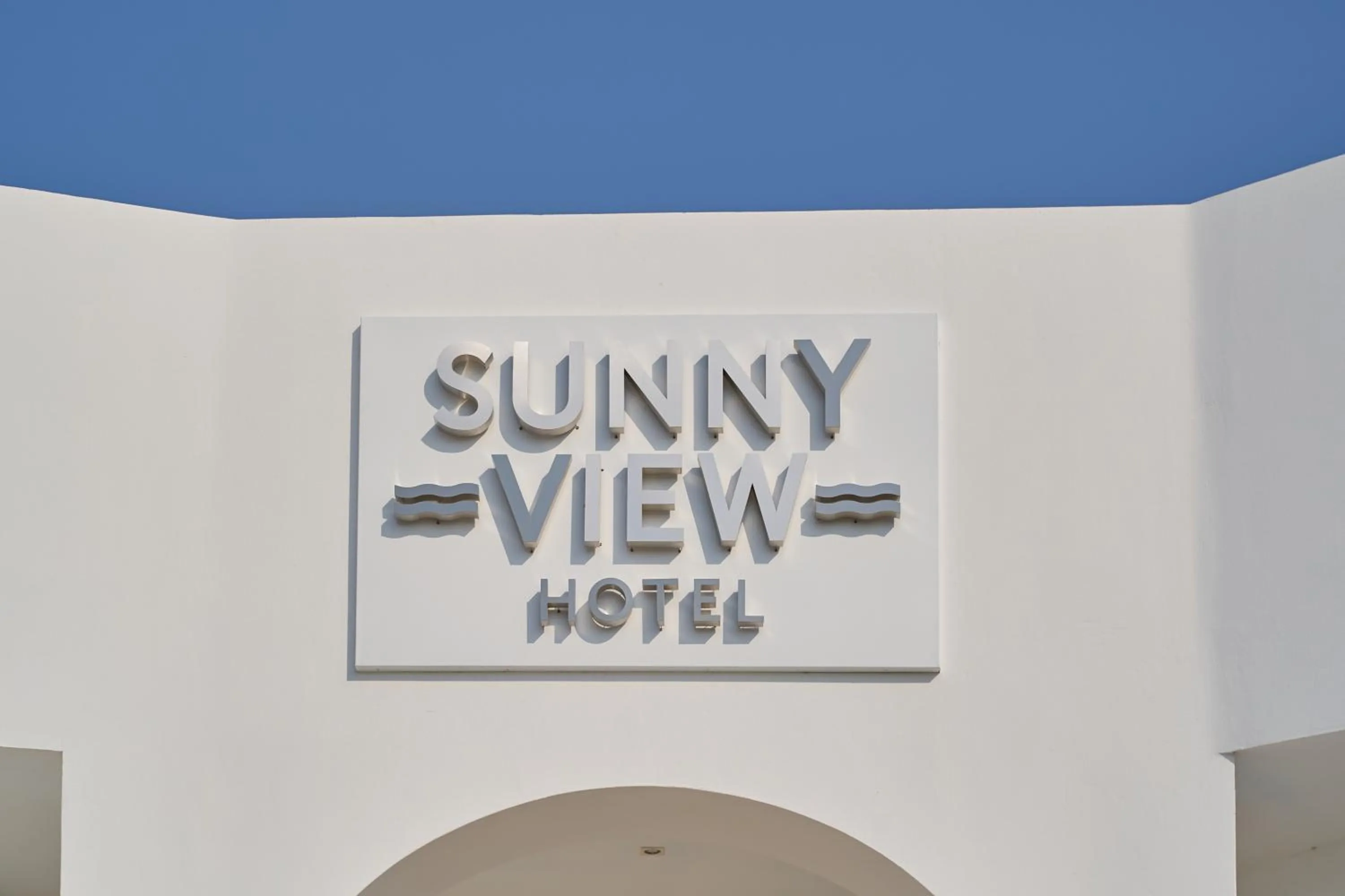 Property logo or sign in Sunny View Hotel