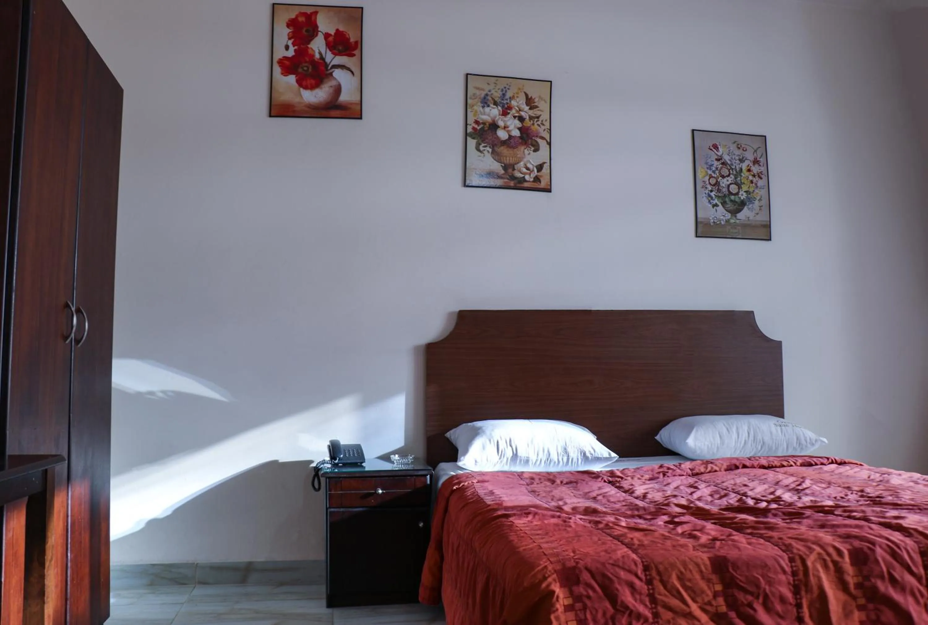 Bed in Grand Suites Hotel