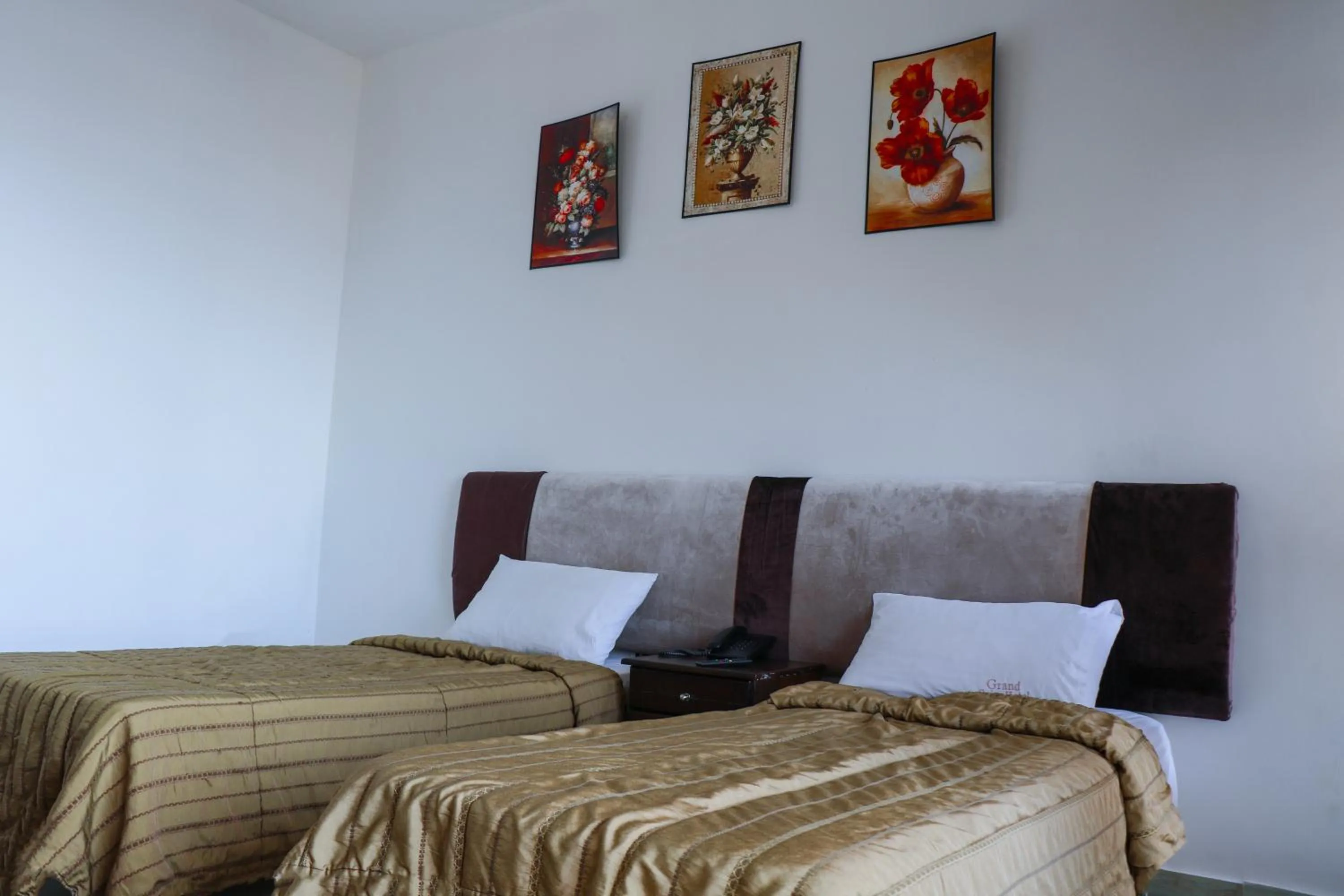 Bed in Grand Suites Hotel