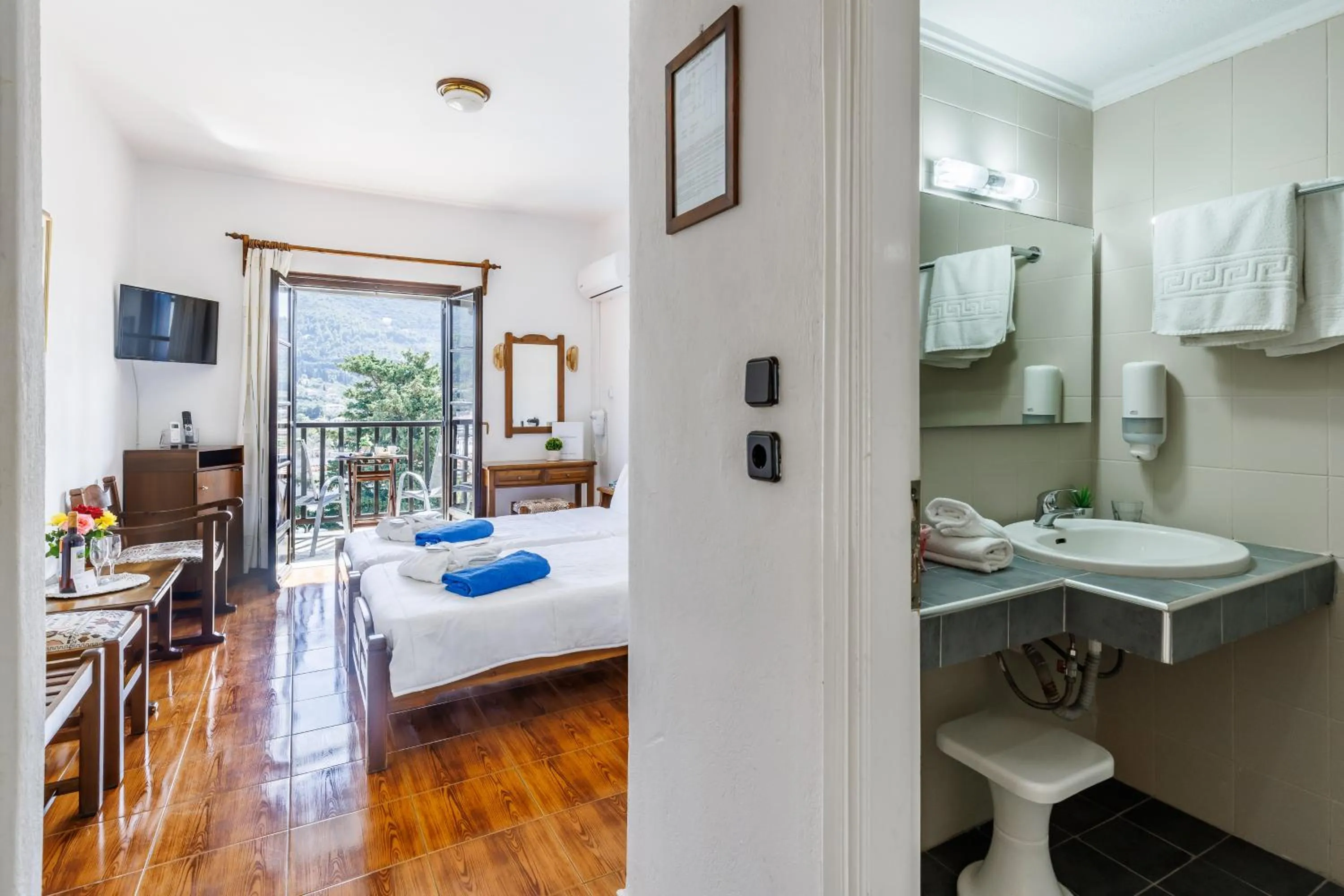 Bed in Hotel Dionyssos